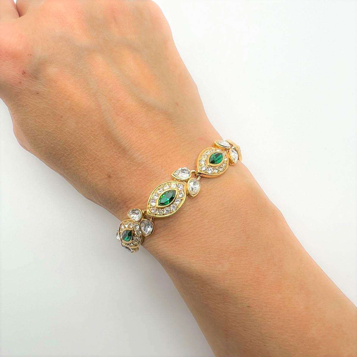 Our vintage Attwood & Sawyer Emerald bracelet. A perfect classic with regal overtones. Emerald glass navettes surrounded by white crystals give an air of the eternally chic combination of emerald and diamonds. Who wouldn't want to adorn their wrist