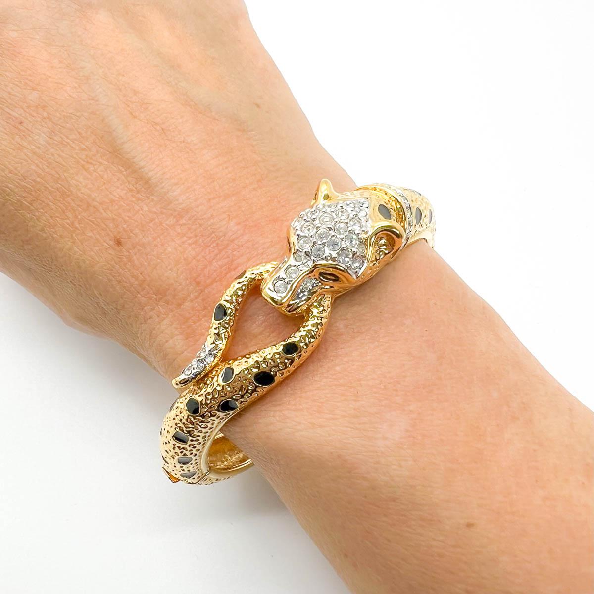 Our vintage Attwood & Sawyer Leopard Bracelet. One of the most glamourous big cat cuffs around this one by the English company Attwood & Sawyer boasts exceptional craftmanship with lustrous gold plate punctuated with glossy black enamel. Pave