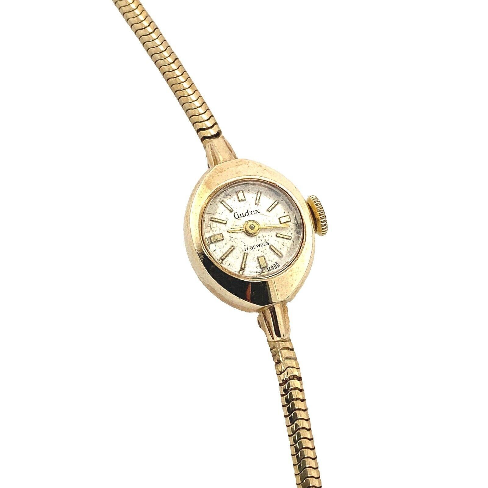 Vintage 9ct Gold Audax Watch, In 9ct Gold Wristwear With Cream Dial

Vintage 9ct gold Audax watch, with cream dial and arrow markers. In 9ct gold wristwear snake bracelet.

Additional Information:
Case Size: 15mm
Case Thickness: 8mm
Strap Width: