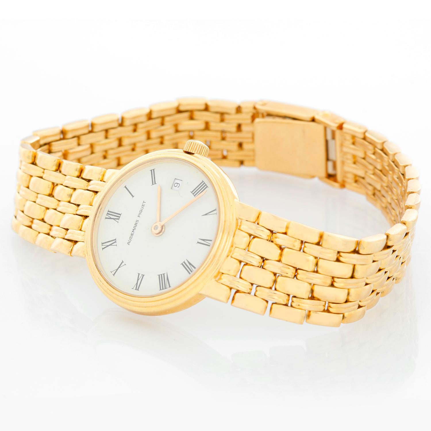 Vintage Audemars Piguet 18K Yellow Gold Ladies Watch - Quartz. 18K yellow gold case with smooth bezel ( 24 mm). Ivory dial with Roman numerals. 18k yellow  gold link bracelet; will fit up to a 6 3/4 inch wrist. Pre-owned with custom box.