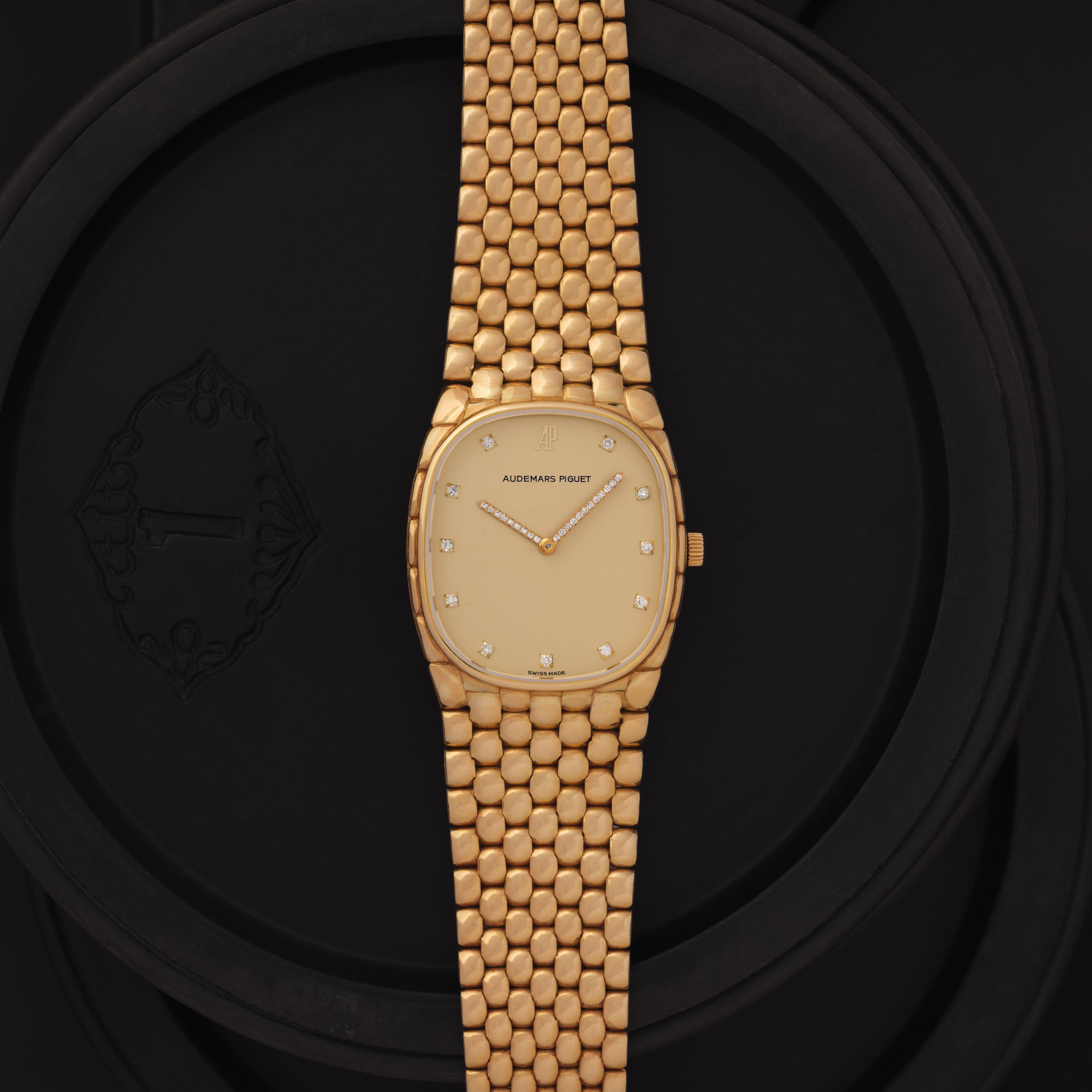 Vintage Audemars Piguet Cobra 18k Yellow Gold Diamond Hands and Diamond Markers, Manual Wind, Made in Switzerland c.1980s 

Maker: Audemars Piguet
Model: Cobra
Year: 1980s
Material: 18 Karat Yellow Gold
Dial: Gold with Diamond Markers and Diamond
