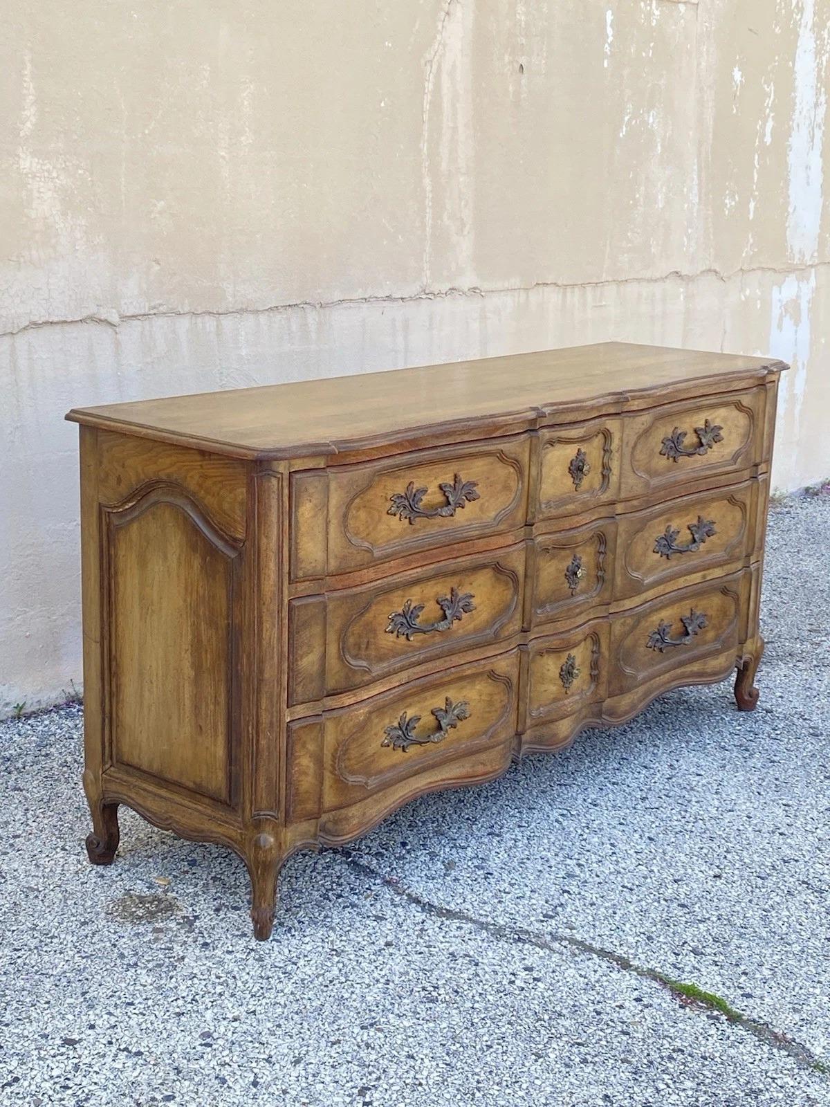 Vintage Auffray & Co French Country Provincial Solid Walnut 9 Drawer Dresser Credenza. Item features dovetailed drawers, ornate solid brass hardware, high quality construction, and original label. Circa Mid 20th Century. Measurements: 35