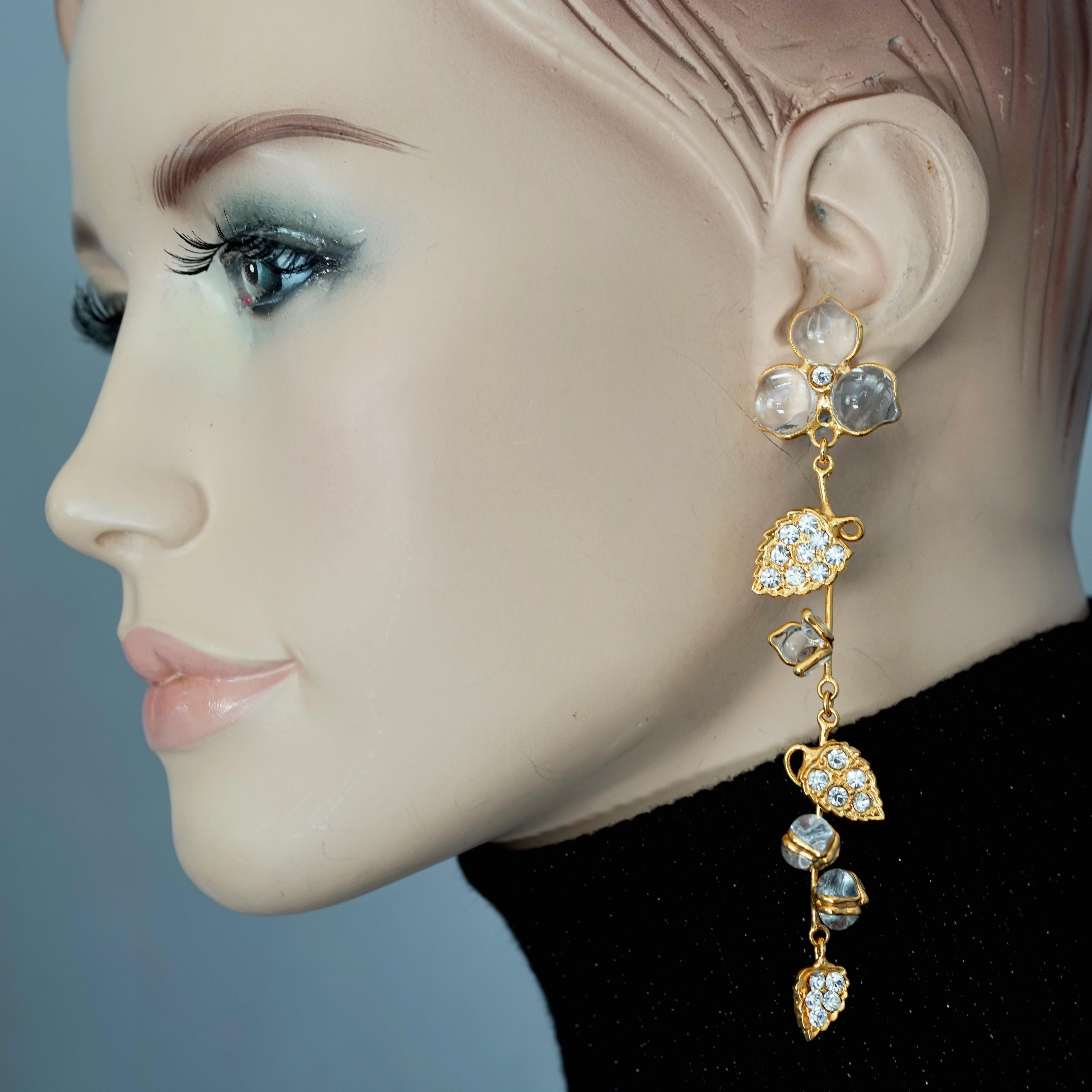Vintage AUGUSTINE PARIS by Thierry GRIPOIX Flower Vine Dangling Earrings

Measurements:
Height: 4.33 inches (11 cm)
Width: 0.86 inch (2.2 cm)
Weight: 11 grams

Features:.
- 100% Authentic AUGUSTINE PARIS by Thierry GRIPOIX.
- Translucent Gripoix/