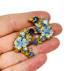 Vintage AUSTRIA gold tone enamel rhinestone flower designer clip on earrings