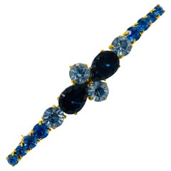 Spilla vintage AUSTRIA con strass blu zaffiro in tonalità oro