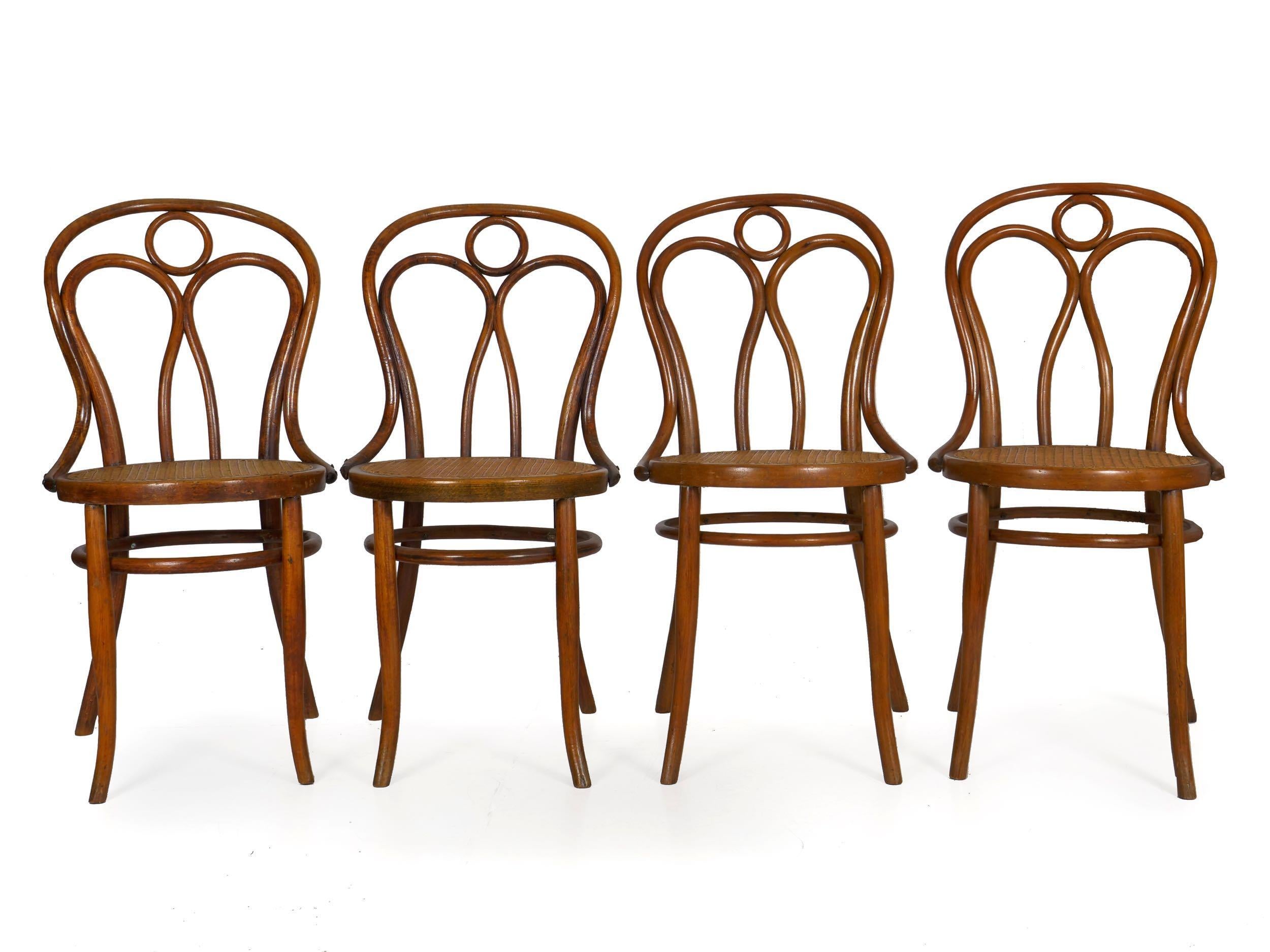 A fine set of late 19th century dining chairs designed by Josef Kohn and manufactured by his firm, one still retaining the original label remnants, this is offered as no. 36 in his catalogue and is a quite rare form with the little circle in the