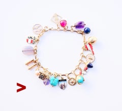 Pulsera de dijes austriacos vintage de oro macizo 14K/18K 20 dijes / 19cm /23.5gr