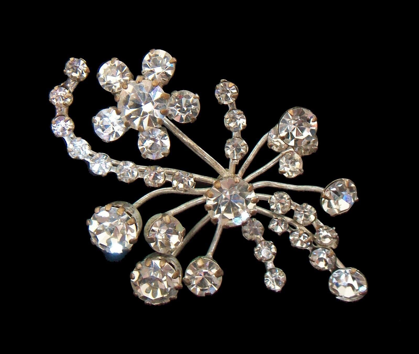 Vintage Austrian crystal rhinestone brooch/pin - fine European quality - graduated sizes of round cut stones - original pin with safety catch - 'MADE IN AUSTRIA' on the back - unsigned - mid 20th century.

Excellent vintage condition - no loss - no