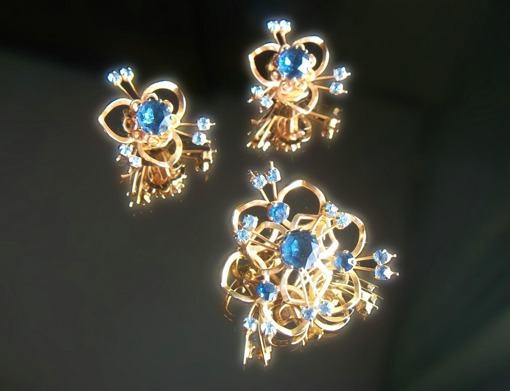 Mid Century Austrian crystal topaz and aquamarine ear clips and brooch/pin in gold tone frames - great quality - unsigned - Austria - circa 1950's.

Excellent vintage condition - safety catch missing on brooch/pin (still closes and holds) - minor