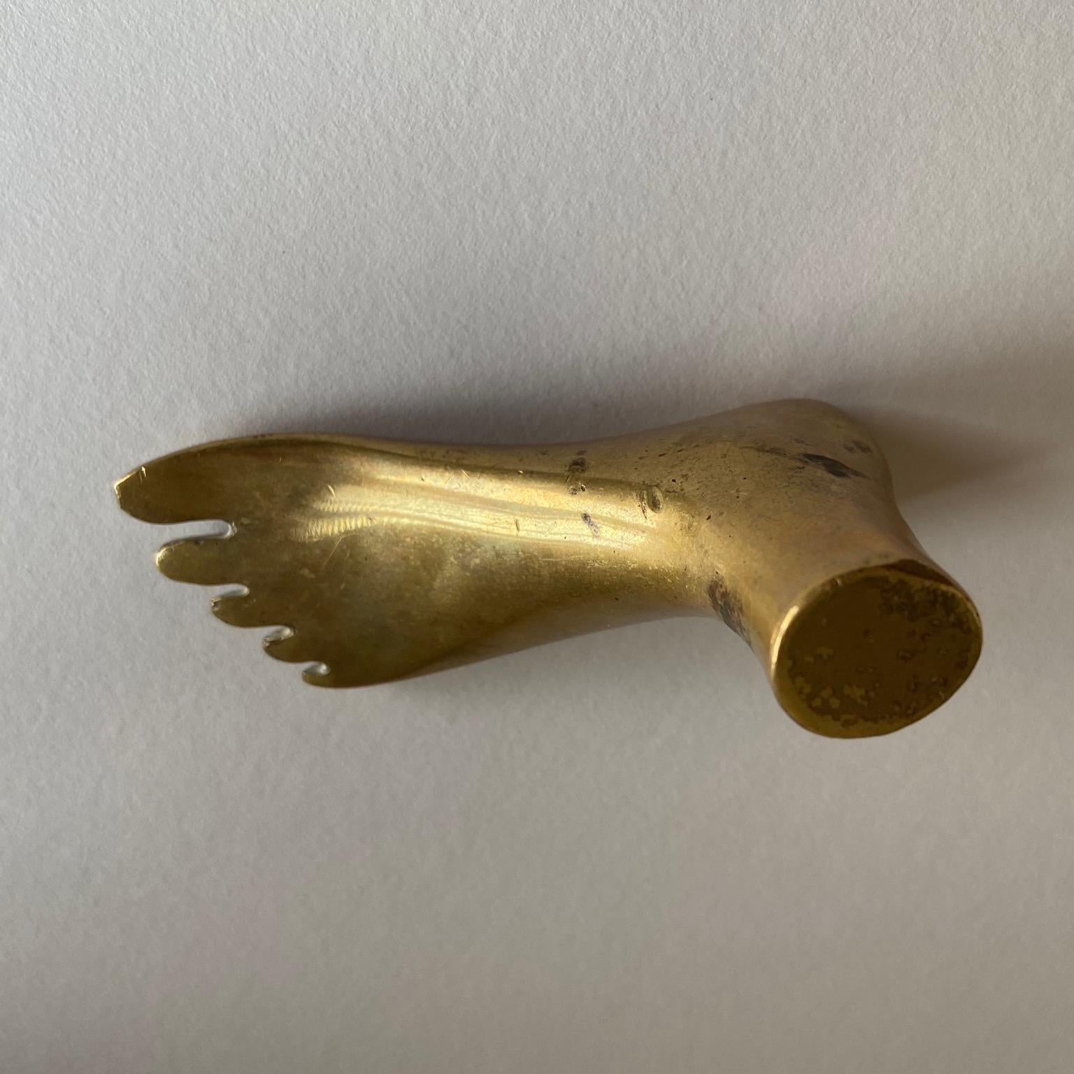 Vintage midcentury brass foot paperweight sculpture by Carl Aubock II.
Impressed Aubock signature as well as 