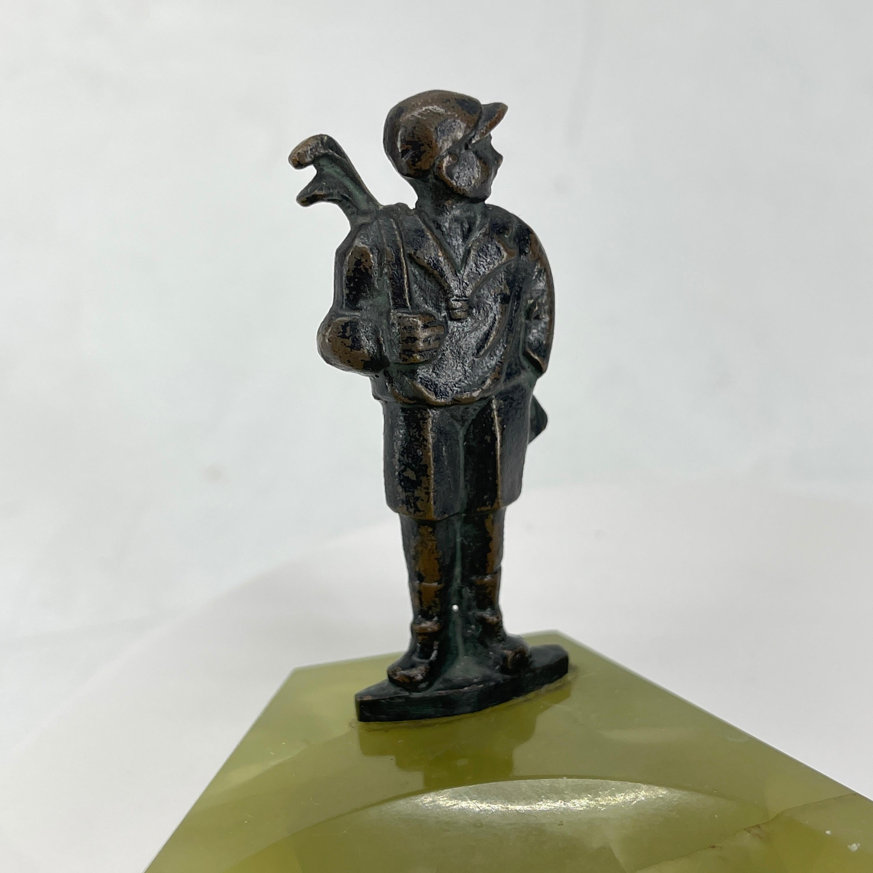 Vintage onyx and bronze ashtray trinket dish with golfer figure.
Austrian Onyx ashtray or dish with bronze golfer figurine. The pistachio (green) onyx dish is beautifully carved with a handsome golfer perched on top. There are endless functions for