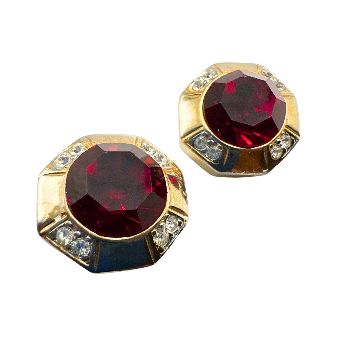 Earring Diameter: 0.87

Bin Code: E11 / P2

Make a stunning statement with this Vintage Austrian Red Cut Glass Earring. Crafted with precision and attention to detail, these earrings exude timeless elegance and capture attention with their