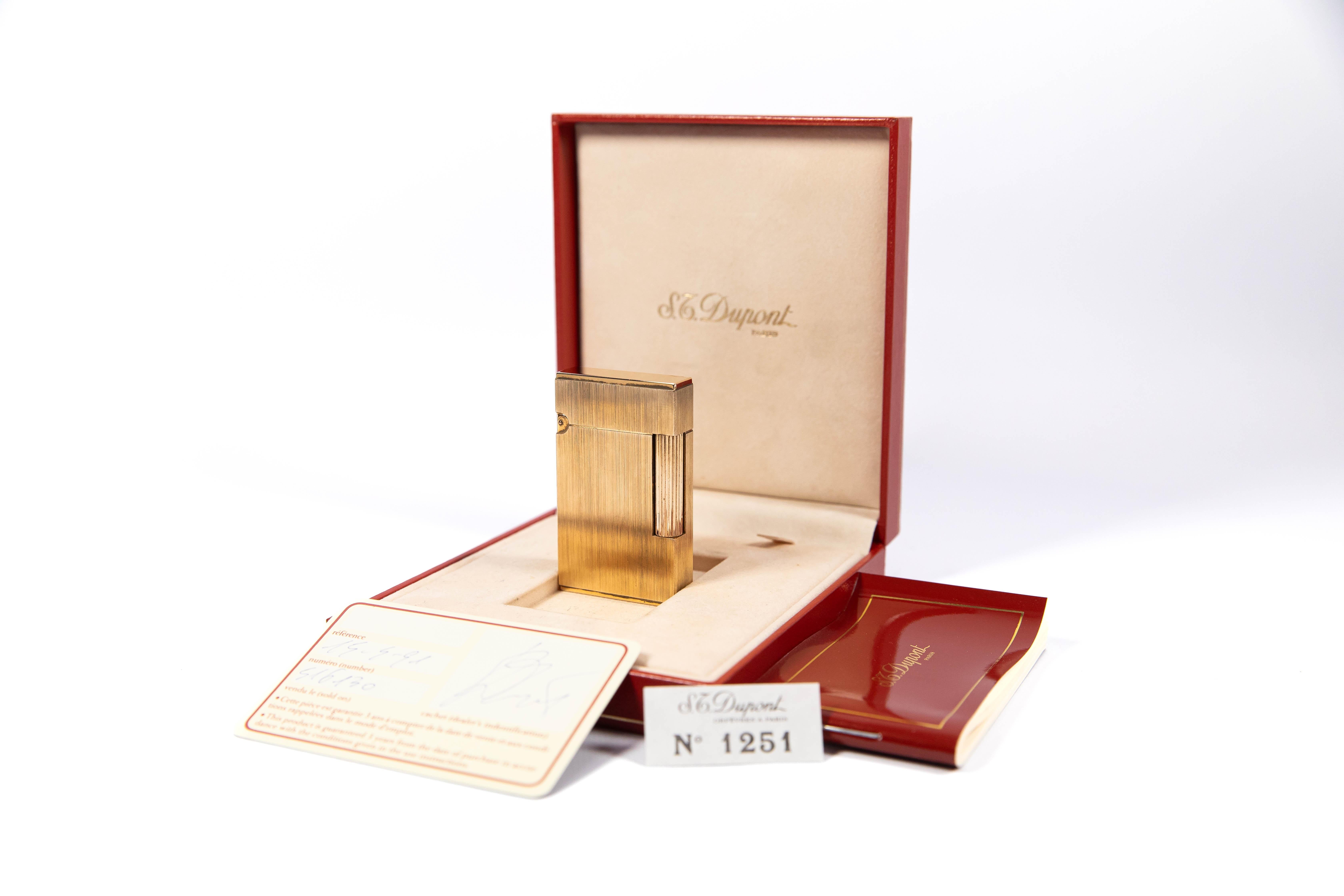 Vintage Authentic brushed gold plated Ligne 2 ST Dupont Lighter from 1991 Complete Box & Papers

The iconic S.T. Dupont name is known for quality, well-made cigarette lighters and other luxury implements. The company’s origin can be traced to Simon