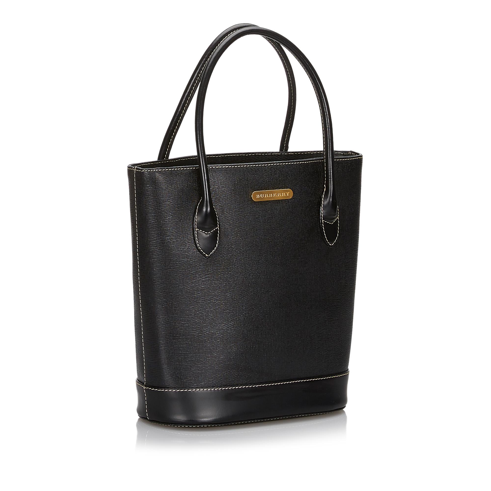 This tote bag features a leather body, rolled handles, an open top, an interior zip compartment, and interior slip pockets. It carries as AB condition rating.

Inclusions: 
This item does not come with inclusions.

Dimensions:
Length: 25.00