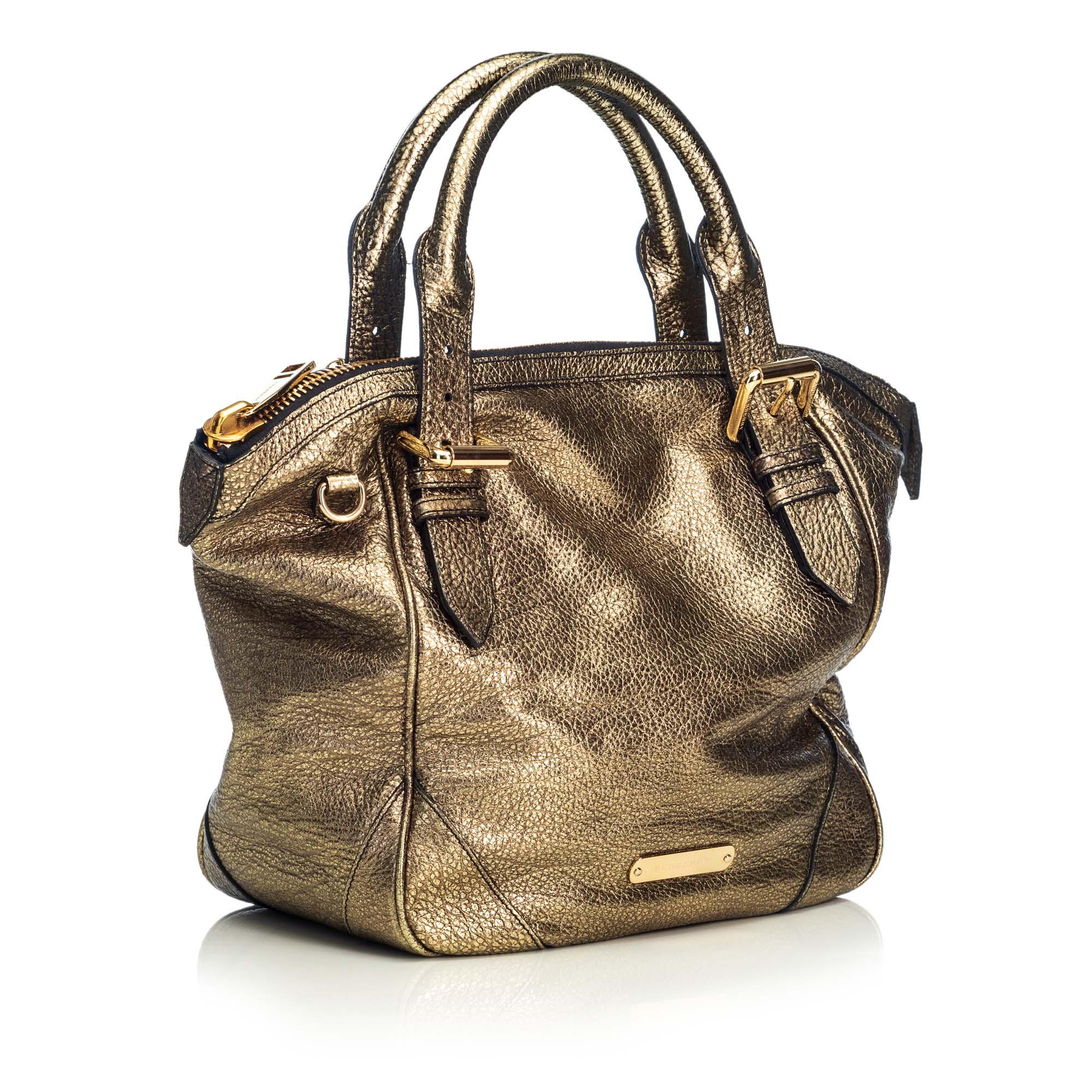 This satchel features a metallic leather body, a rolled leather handle, a detachable leather strap, a top zip closure, and an interior zip pocket. It carries as AB condition rating.

Inclusions: 
Dust Bag
Dimensions:
Length: 42.00 cm
Width: 31.00