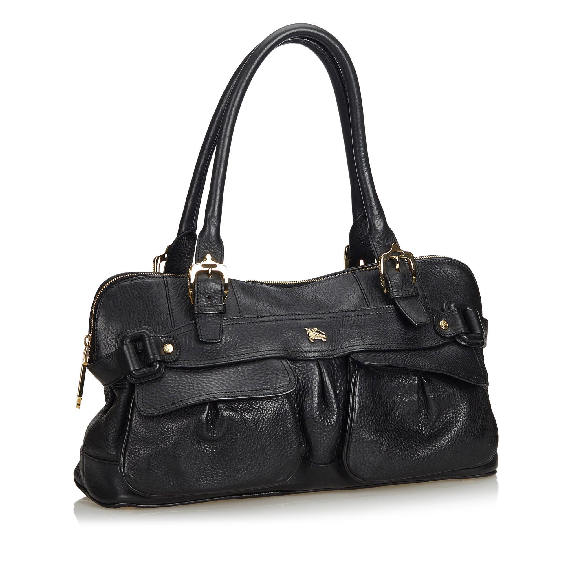 This shoulder bag features a leather body, front exterior flap pockets, rolled leather handles, a top zip closure, and interior zip and slip pockets. It carries as B+ condition rating.

Inclusions: 
Dust Bag

Dimensions:
Length: 23.00 cm
Width: