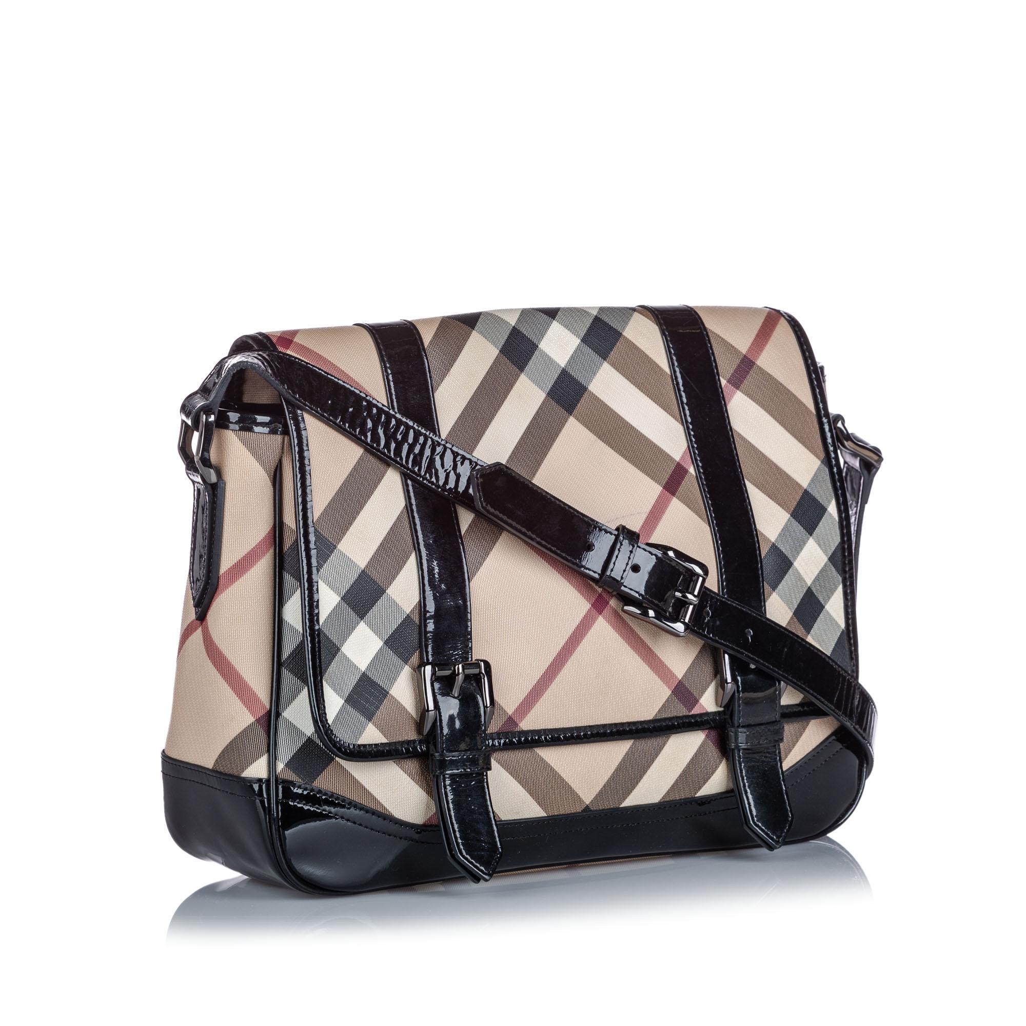 This crossbody bag features a plaid coated canvas body with patent leather trim, a flat patent leather strap, a top flap with magnetic closures, and interior slip pockets. It carries as B+ condition rating.

Inclusions: 
Dust Bag
Dimensions:
Length: