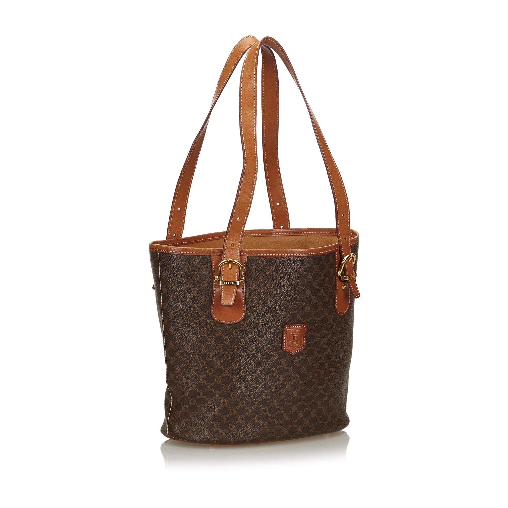 This tote bag features a PVC body with leather trim, flat leather straps, an open top, and interior zip compartment and pocket. It carries as B+ condition rating.

Inclusions: 
This item does not come with inclusions.

Dimensions:
Length: 23.00