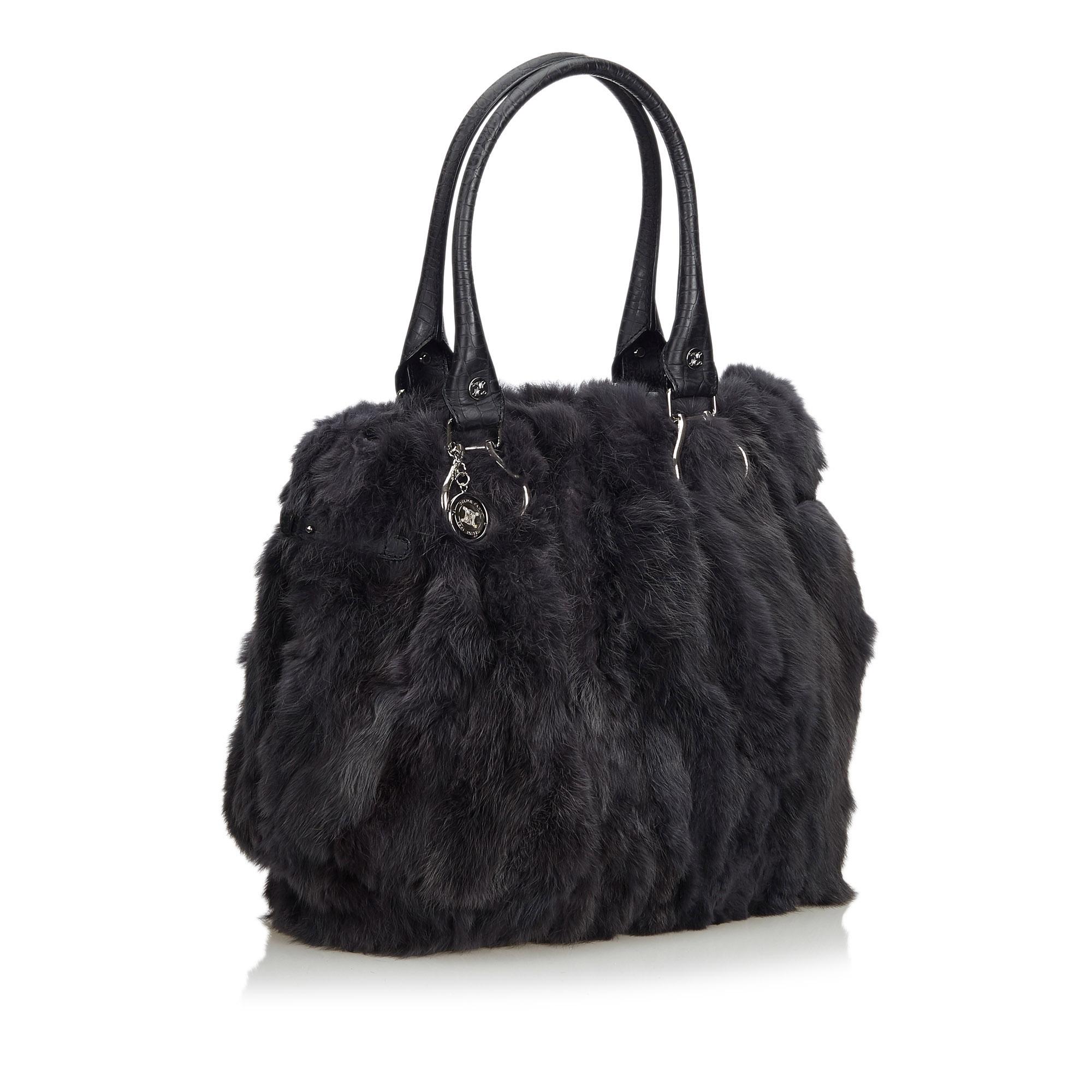 This tote bag features a fur body with leather trim, rolled leather handles, an open top, and interior zip and slip pockets. It carries as B+ condition rating.

Inclusions: 
This item does not come with inclusions.

Dimensions:
Length: 33.00