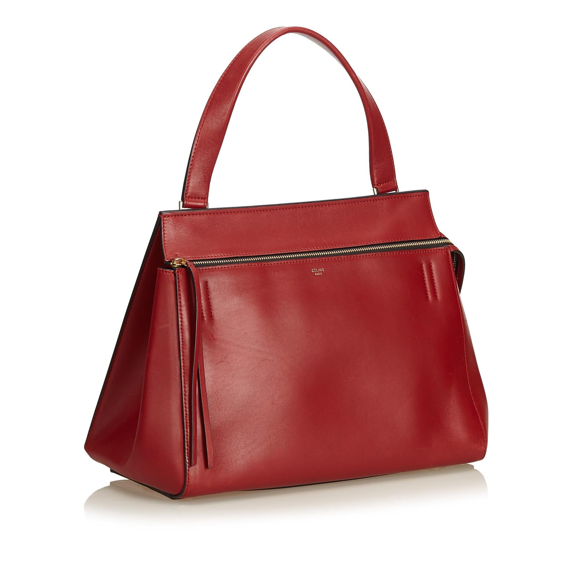 The Large Edge Bag features a leather body, exterior front zip pocket, back slip pocket, flat leather handles, top zip closure, and interior slip pockets. It carries as B+ condition rating.

Inclusions: 
Dust Bag

Dimensions:
Length: 27.00 cm
Width:
