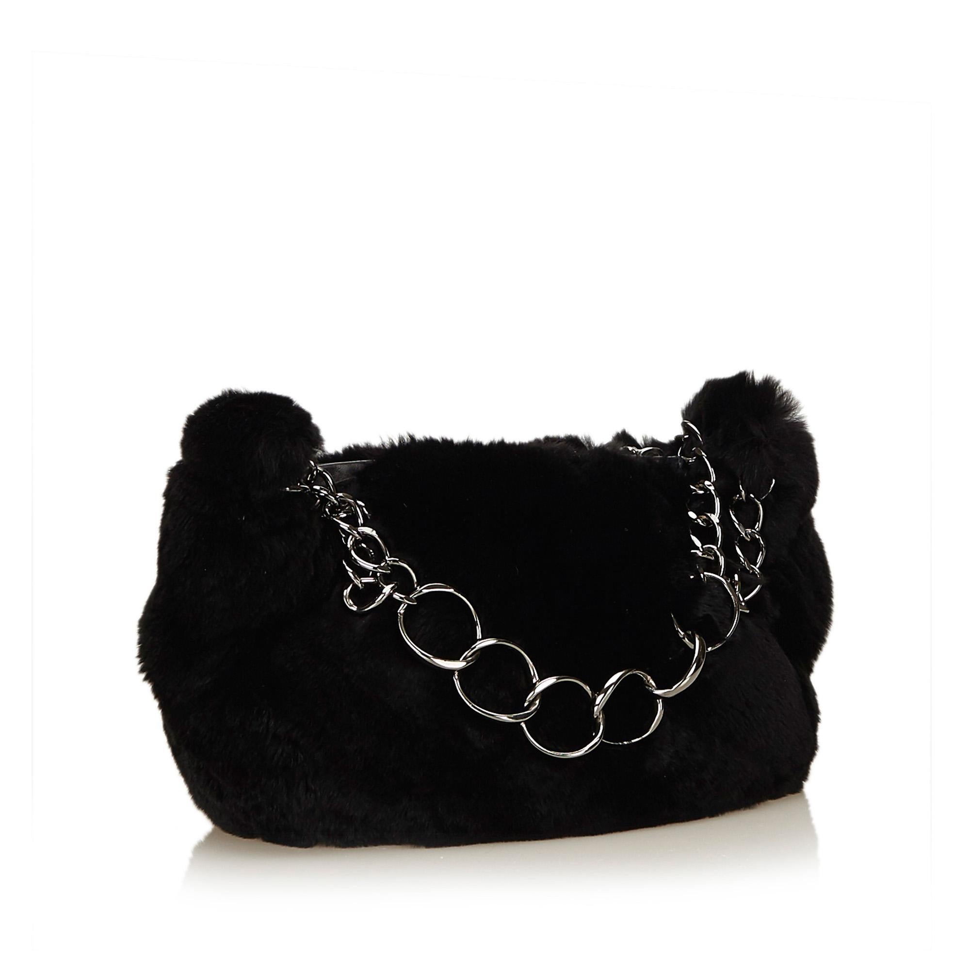 This handbag features a fur body, silver-tone chain, and a top zip closure. It carries as B+ condition rating.

Inclusions: 
Dust Bag
Authenticity Card

Dimensions:
Length: 25.00 cm
Width: 15.00 cm
Depth: 8.00 cm
Hand Drop: 15.00 cm

Serial Number: