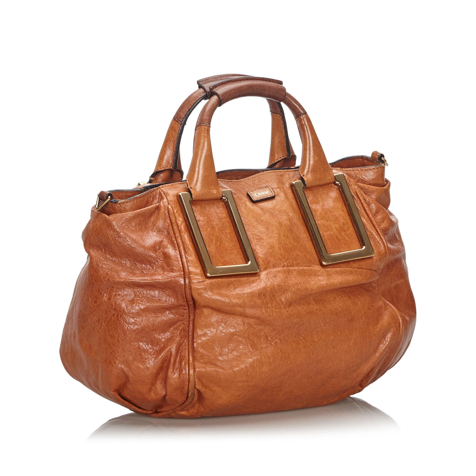 The Ethel features a leather body, rolled handles, a flat leather strap, a gold-tone hardware, a top zip closure, and an interior zip pocket. It carries as B+ condition rating.

Inclusions: 
Dust Bag
Dimensions:
Length: 25.00 cm
Width: 35.00