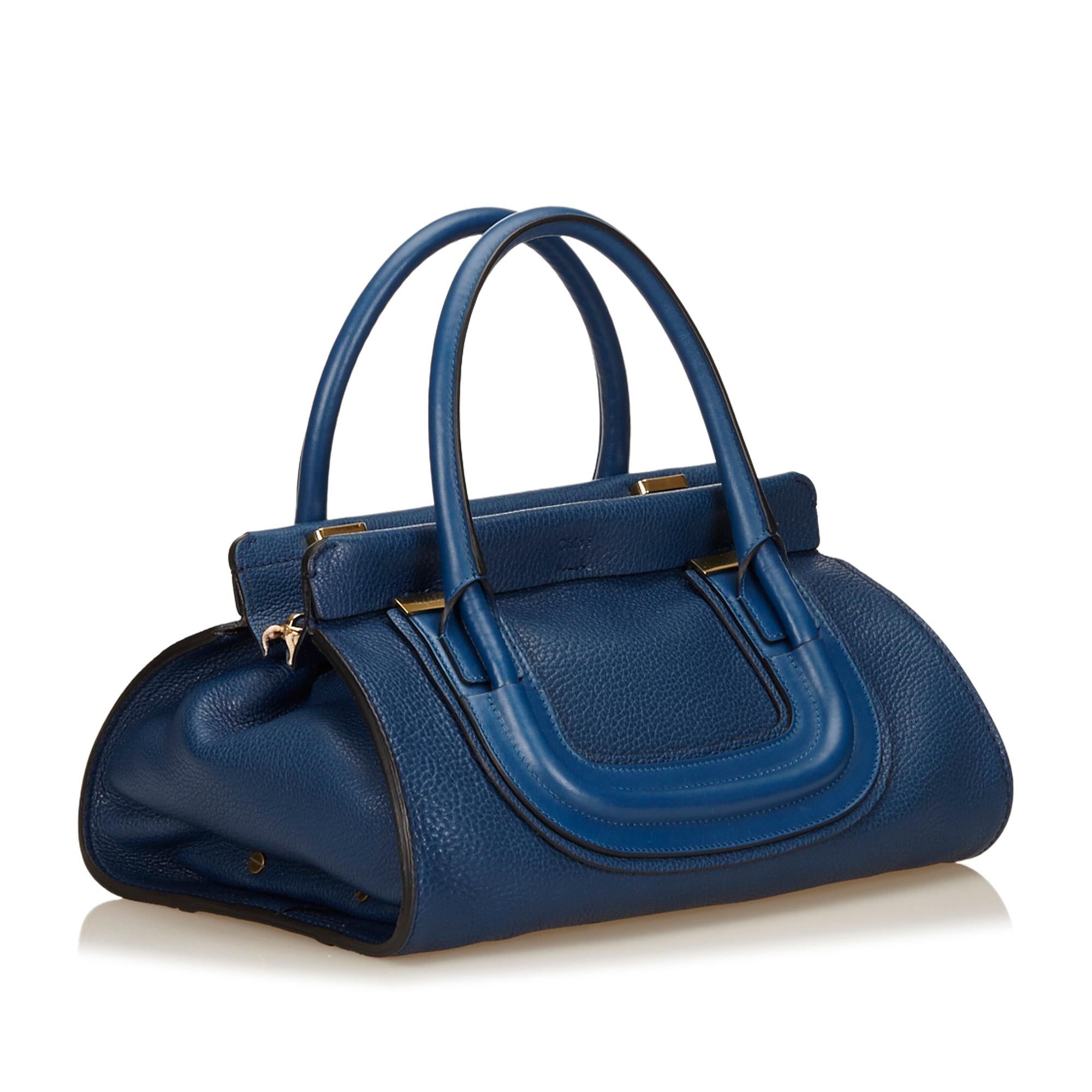 The Everston features a leather body, rolled handles with gold-tone hardware, a top zip closure, and an interior zip pocket. It carries as AB condition rating.

Inclusions: 
Dust Bag
Authenticity Card

Dimensions:
Length: 33.00 cm
Width: 21.00