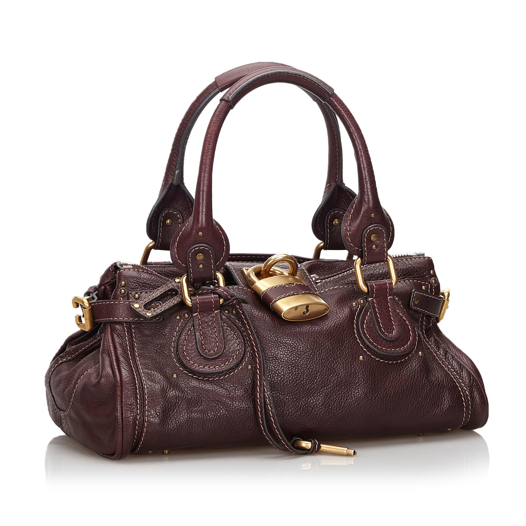 Ce sac à main est doté d'un corps en cuir, d'anses en cuir roulées, d'un cadenas en métal doré, d'une fermeture zippée sur le dessus et de poches intérieures zippées et coulissantes. Il est classé B+.

Inclusions : 
Sac à
