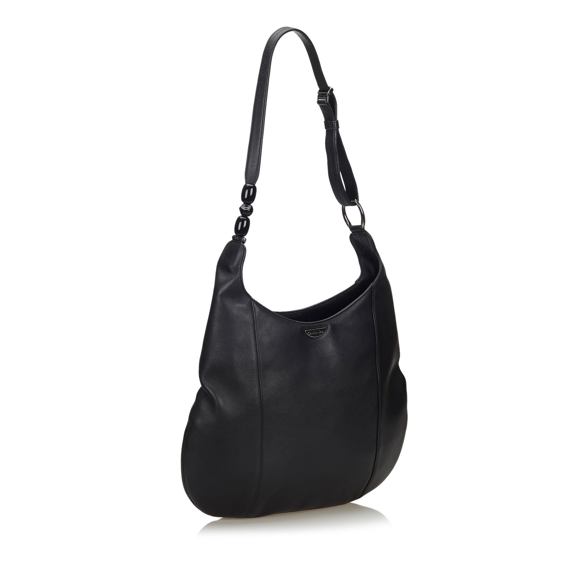 This hobo bag features a leather body, a flat leather strap with pearl detail, a top zip closure, and an interior zip pocket. It carries as AB condition rating.

Inclusions: 
This item does not come with inclusions.

Dimensions:
Length: 27.00