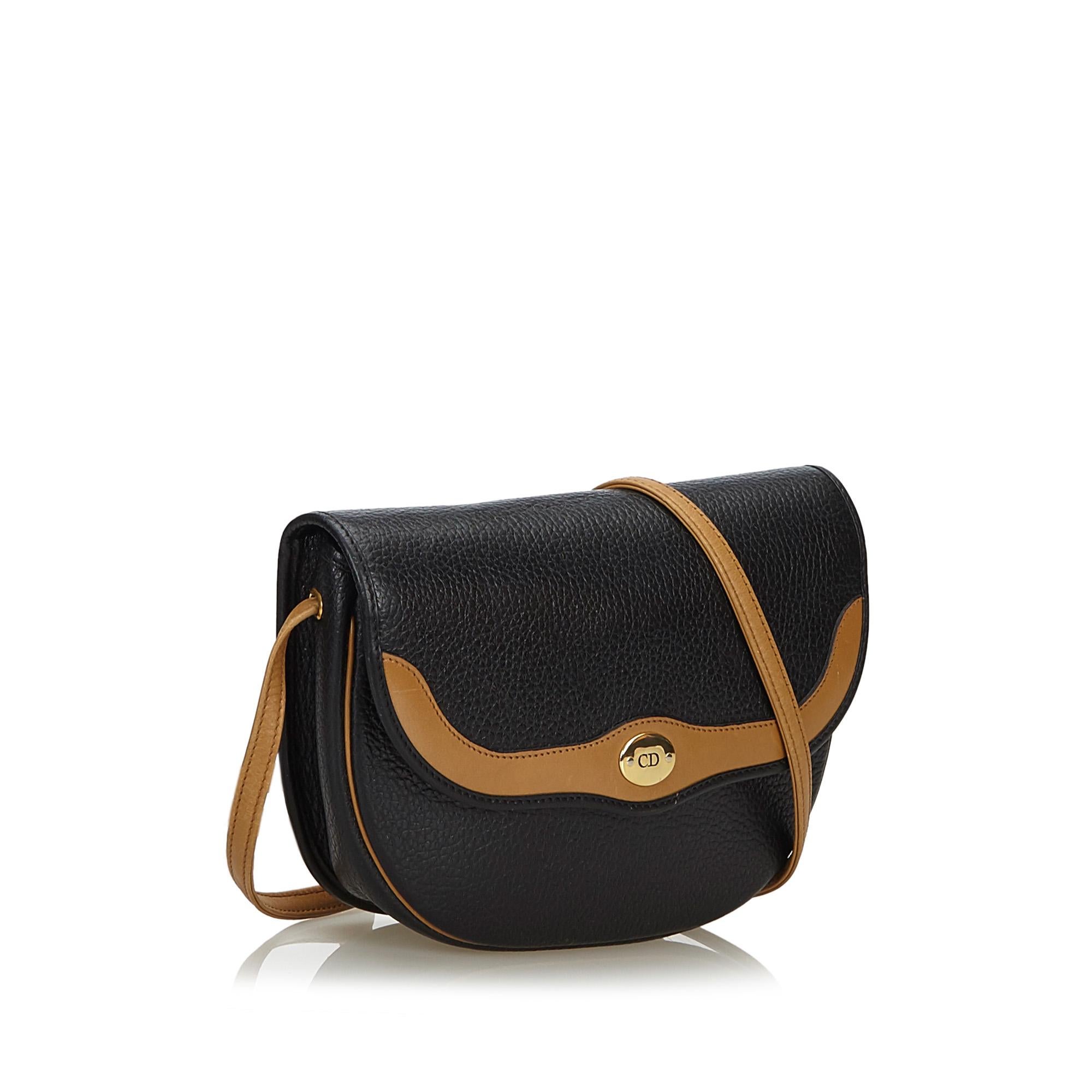 This crossbody bag features a leather body, a flat strap, a front flap with a magnetic snap button closure, and an interior zip pocket. It carries as B+ condition rating.

Inclusions: 
This item does not come with inclusions.

Dimensions:
Length: