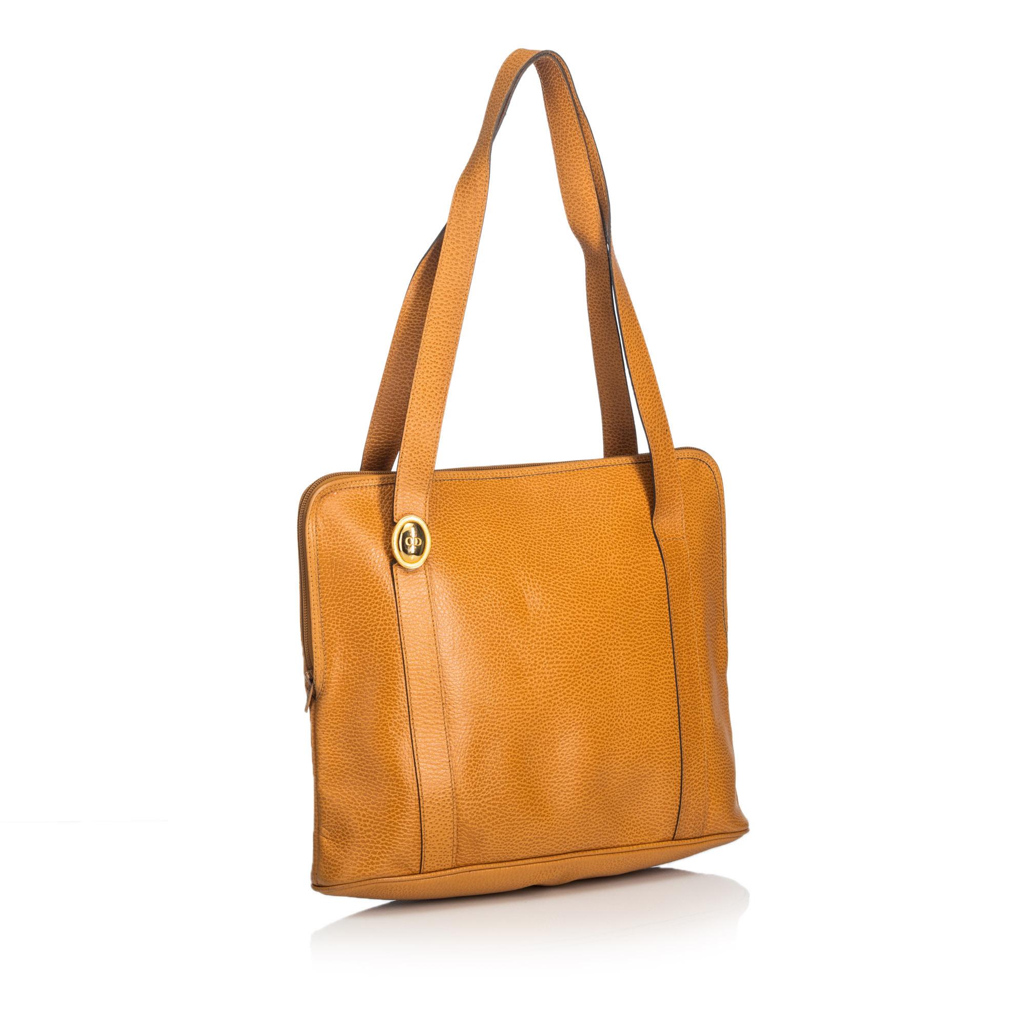 This tote bag features a leather body, flat leather handles, top zip closure, and an interior zip pocket. It carries as B+ condition rating.

Inclusions: 
This item does not come with inclusions.

Dimensions:
Length: 27.00 cm
Width: 36.00 cm
Depth: