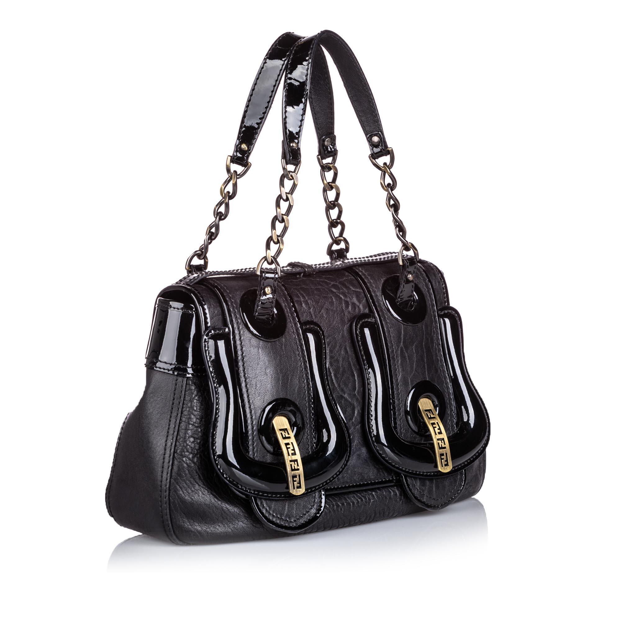 The B Bis handbag features a leather body with patent leather trim, a single chain-link strap with leather shoulder guard, fold-in front flap closure, and an interior slip pocket. It carries as AB condition rating.

Inclusions: 
Dust