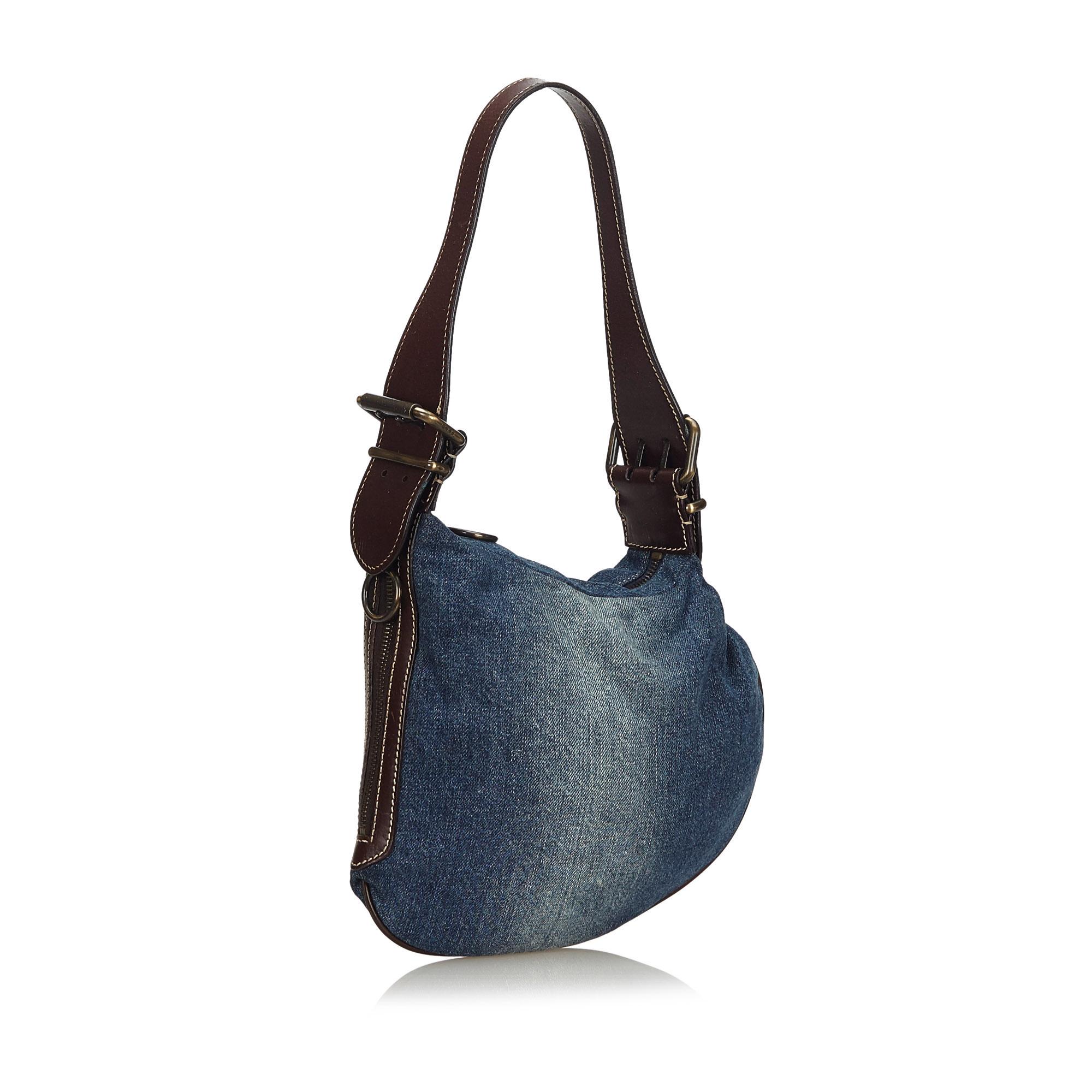 The Oyster bag features a denim body, flat leather strap, and a top zip closure. It carries as AB condition rating.

Inclusions: 
This item does not come with inclusions.

Dimensions:
Length: 23.00 cm
Width: 26.00 cm
Depth: 3.00 cm
Shoulder Drop: