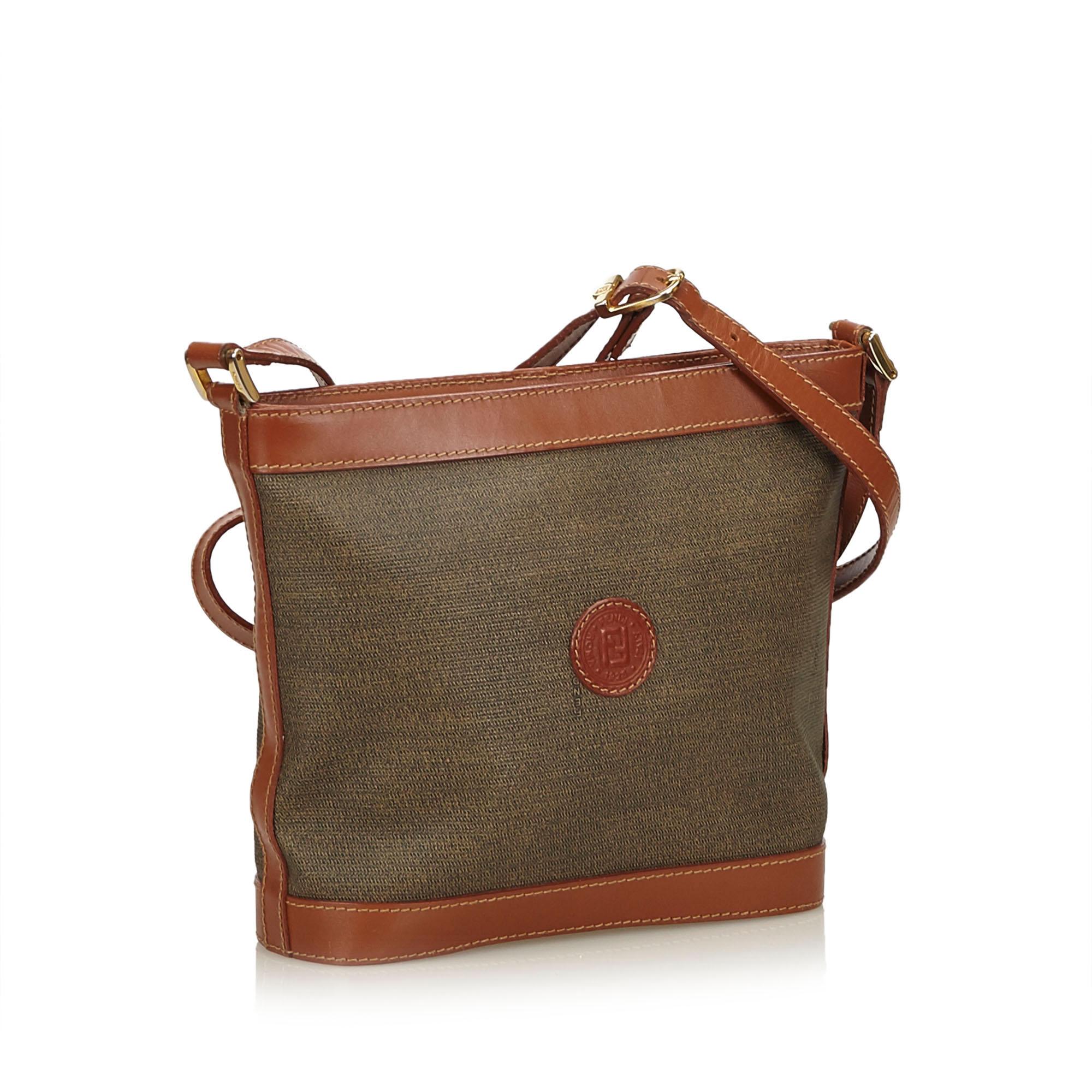 This crossbody bag features a pvc body with leather trim, flat leather strap, and a top zip closure. Watch Specifications: Face: about 1.8 cm × 1.8 cm Case: about 2.8 cm × 2.4 cm excluding crown Belt width: about 1.4 cm Arm around: about 16 cm It