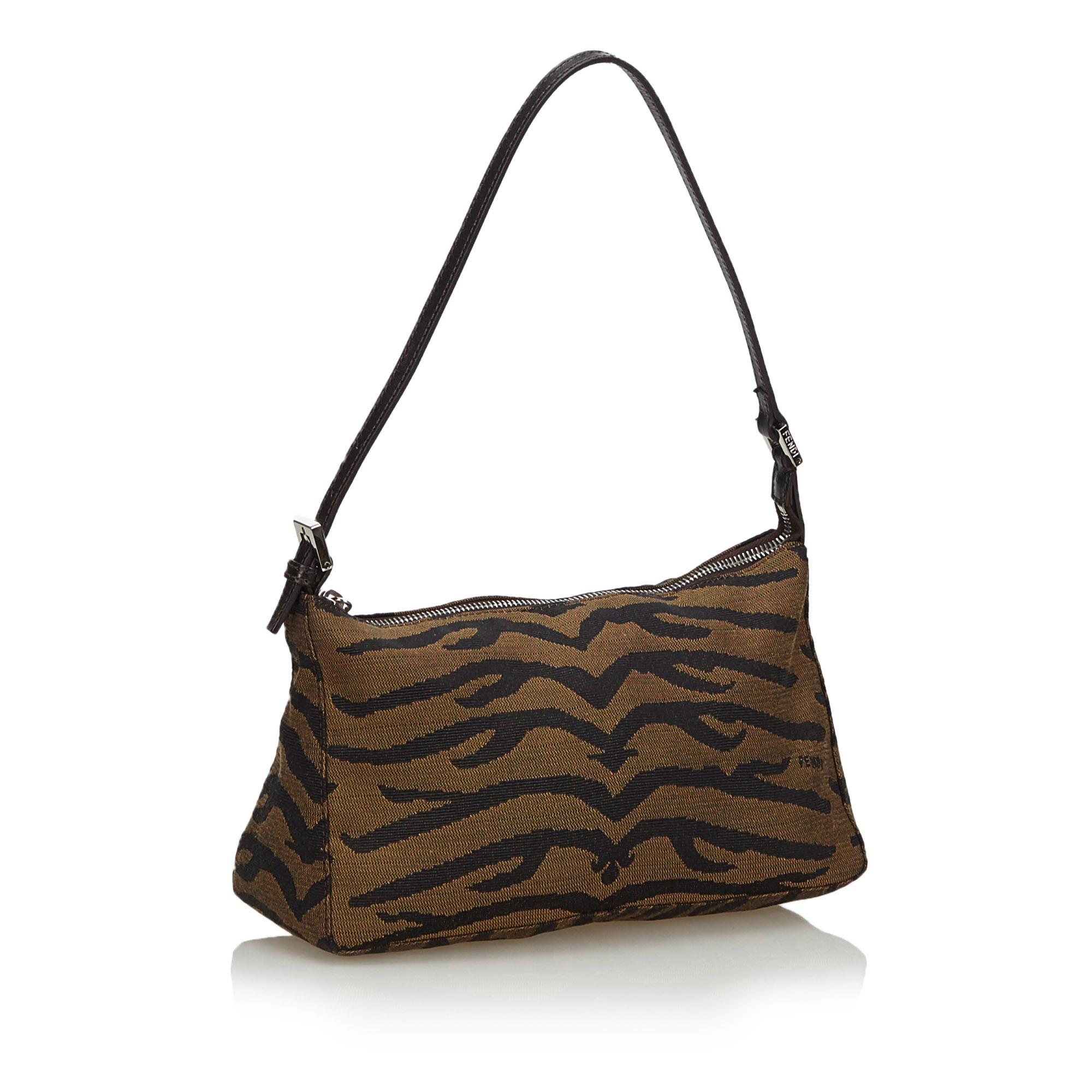 This baguette features a canvas body, a flat leather strap, a top zip closure, and an interior slip pocket. It carries as B+ condition rating.

Inclusions: 
This item does not come with inclusions.

Dimensions:
Length: 15.00 cm
Width: 24.00