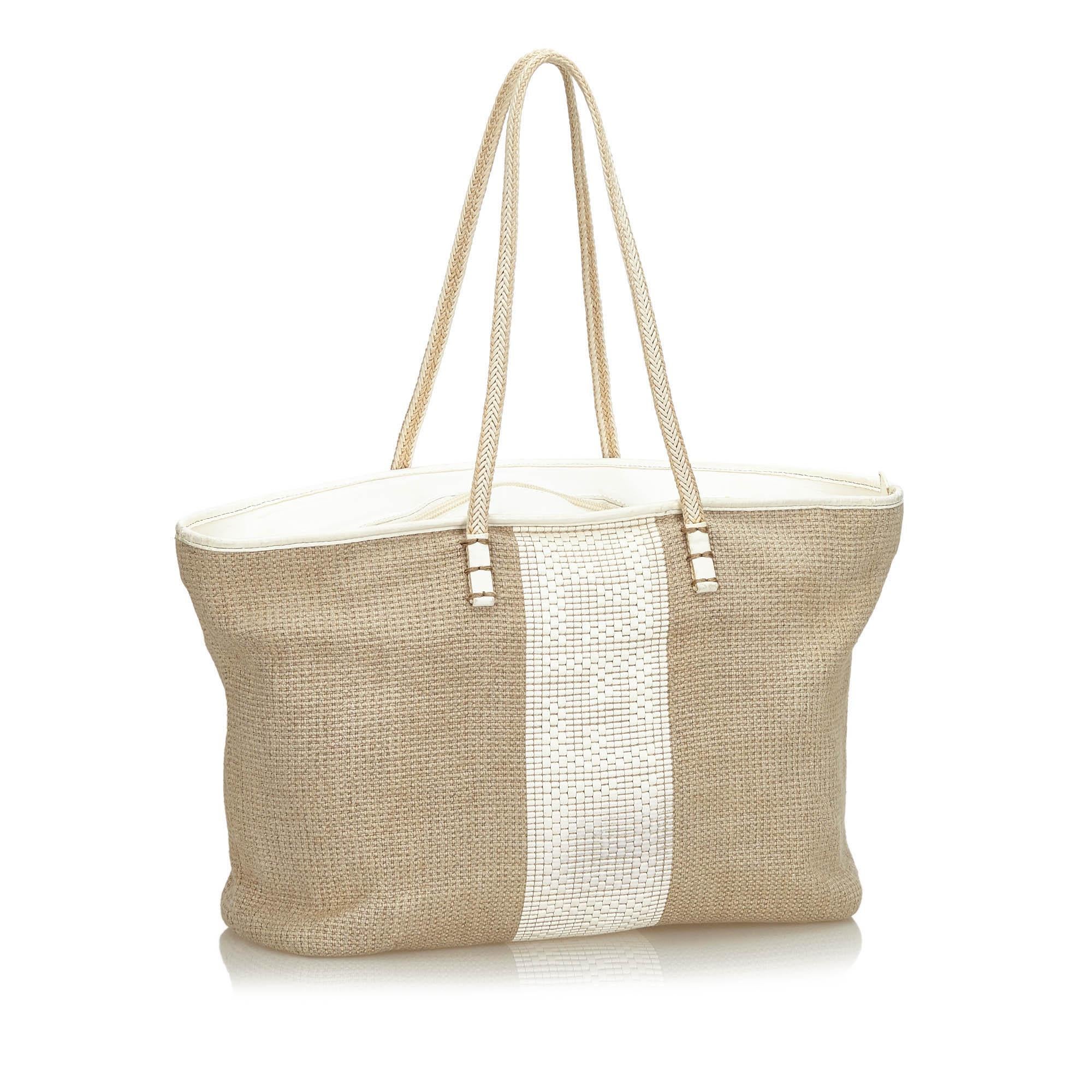 This tote features a hemp body, flat leather straps, a top zip closure, and an interior slip pocket. It carries as AB condition rating.

Inclusions: 
This item does not come with inclusions.

Dimensions:
Length: 26.00 cm
Width: 48.00 cm
Depth: 13.00