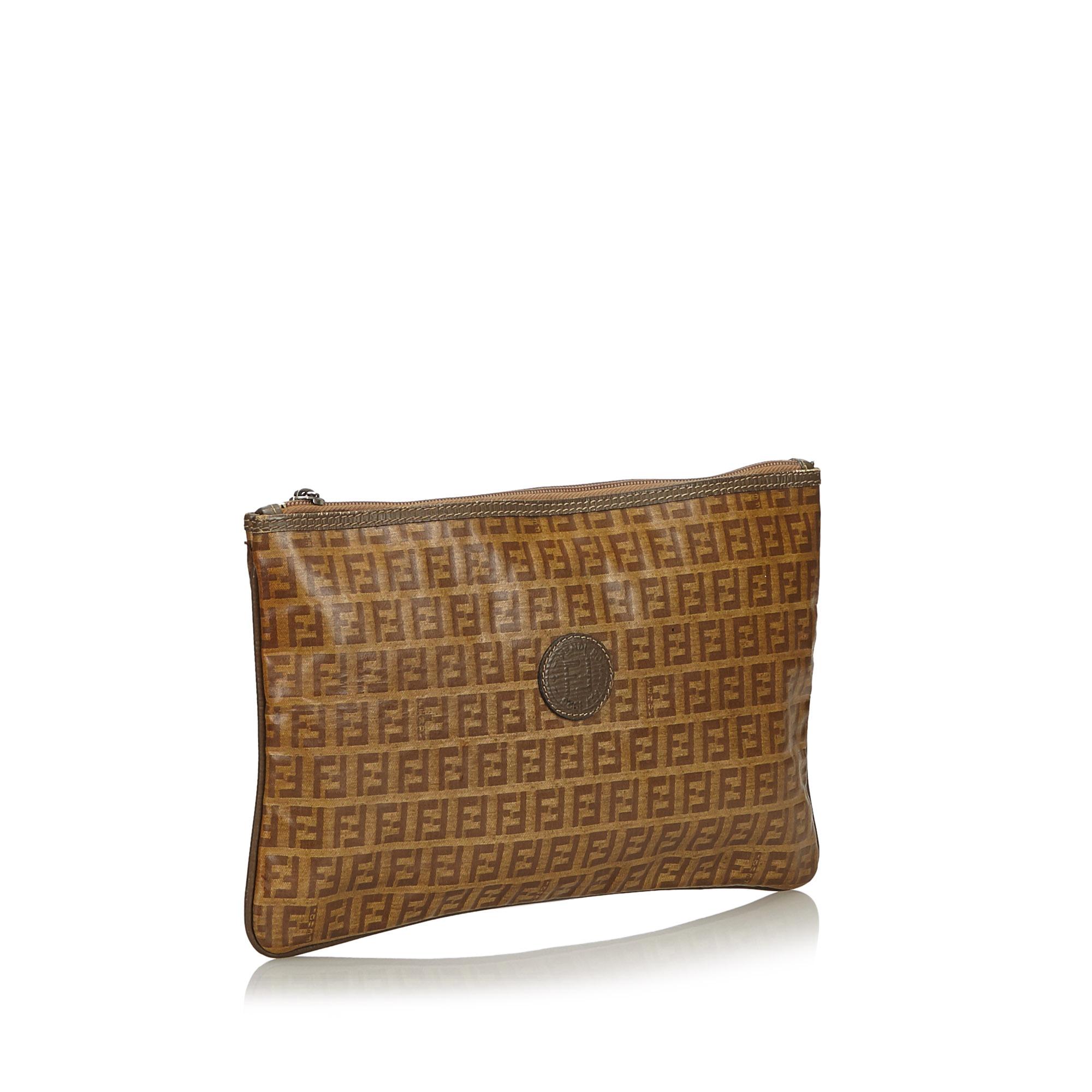 This clutch bag features a coated canvas body with leather trim and a top zip closure. It carries as B condition rating.

Inclusions: 
This item does not come with inclusions.

Dimensions:
Length: 18.00 cm
Width: 29.00 cm
Depth: 0.50 cm

Material: