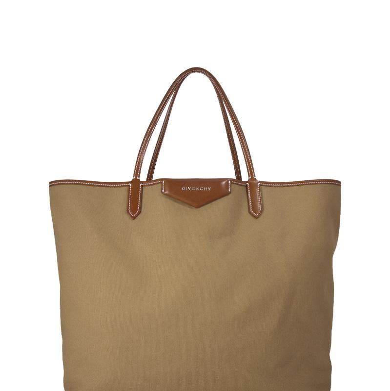 The Antigona Shopper Tote features a cotton body with leather trim, flat leather straps, and an open top. It carries as B+ condition rating.

Inclusions: 
Pouch

Dimensions:
Length: 33.00 cm
Width: 39.00 cm
Depth: 19.00 cm
Shoulder Drop: 18.00