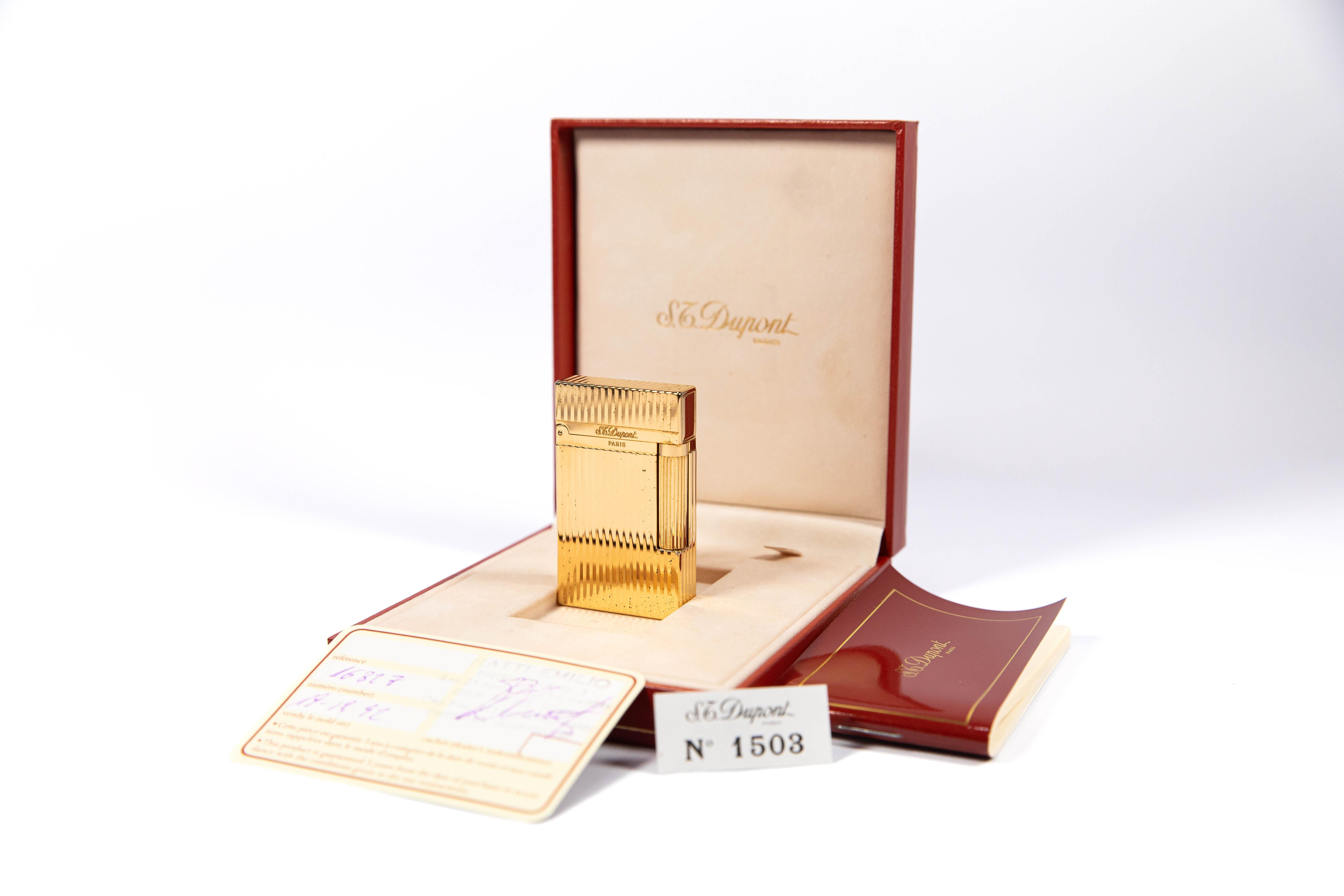 Vintage NOS Authentic Gold plated Ligne 2 ST Dupont Lighter from 1992 Complete Box & Papers

The iconic S.T. Dupont name is known for quality, well-made cigarette lighters and other luxury implements. The company’s origin can be traced to Simon