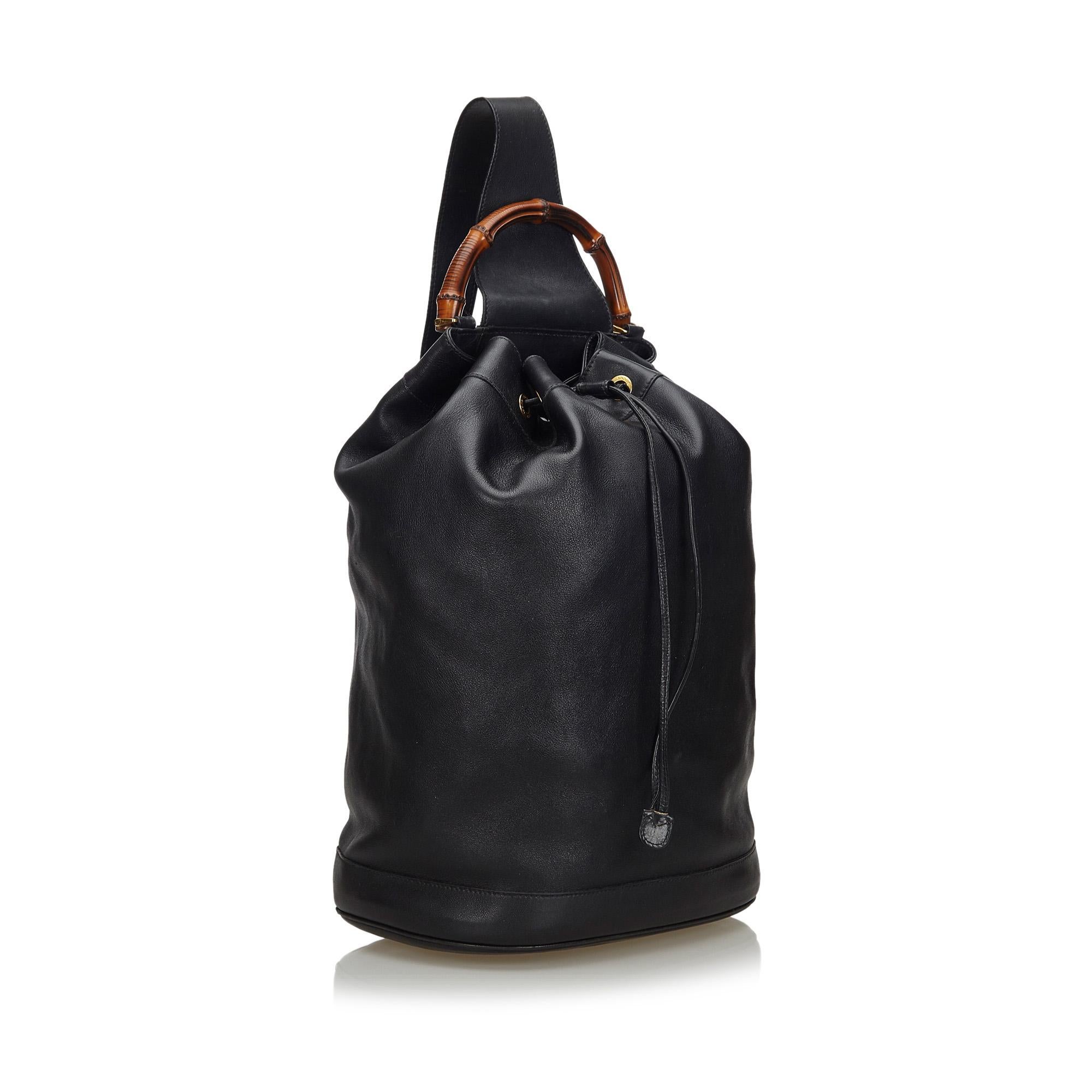This backpack features a leather body, an adjustable flat strap, a bamboo top handle, a drawstring closure, and an interior zip pocket. It carries as B condition rating.

Inclusions: 
This item does not come with inclusions.

Dimensions:
Length: