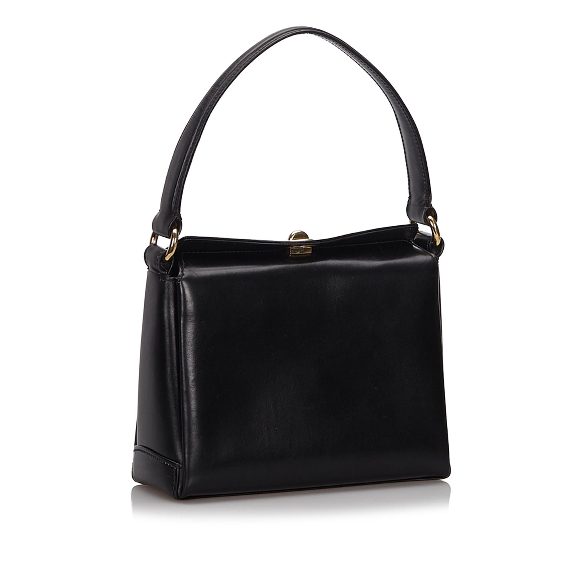 This handbag features a leather body, a flat strap, a fold over top with a metal twist lock closure, and an interior slip pocket. It carries as B+ condition rating.

Inclusions: 
This item does not come with inclusions.

Dimensions:
Length: 16.00