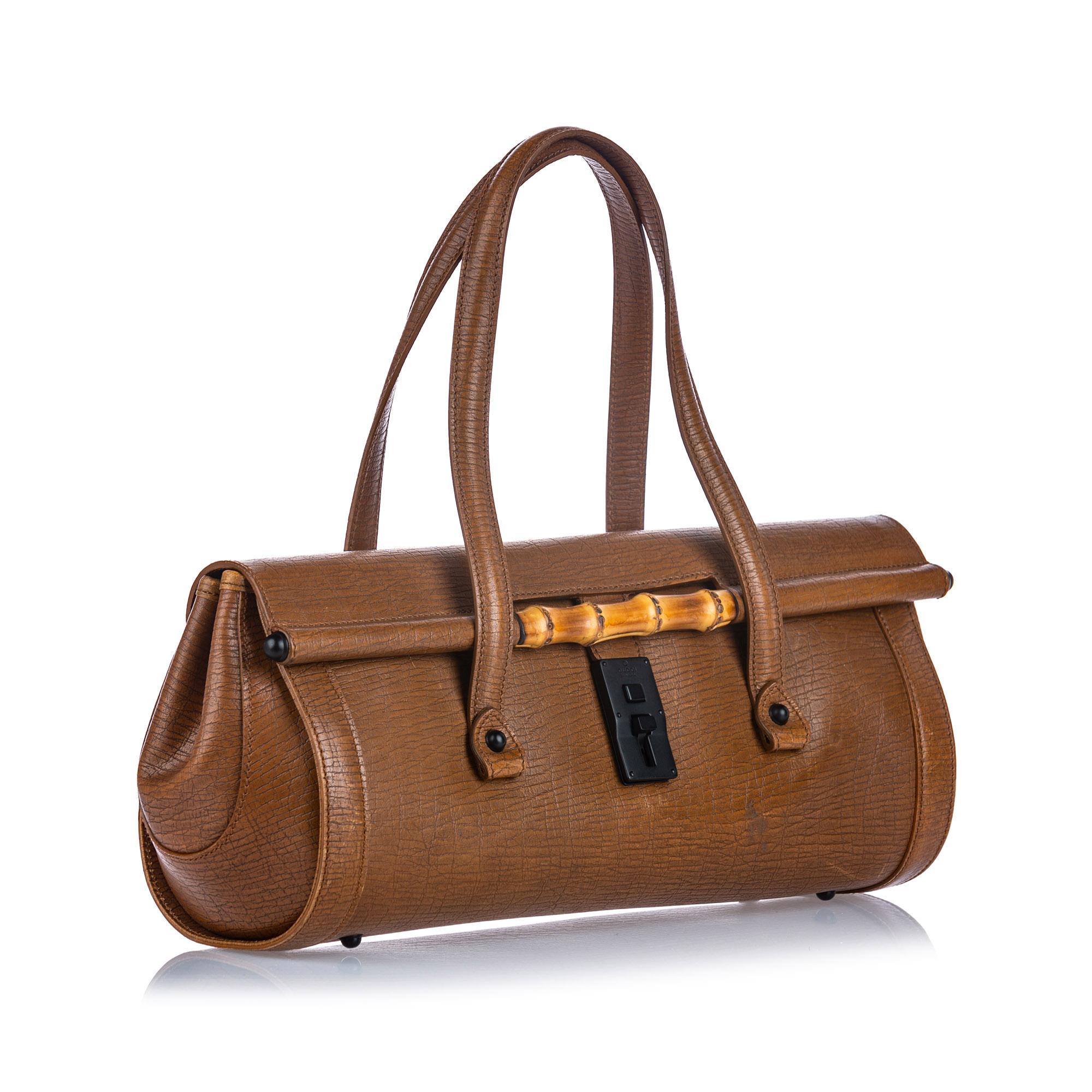 The Bamboo Bullet handbag features a leather body, flat leather handles, a front flap with a push lock closure, and an interior zip pocket. It carries as B condition rating.

Inclusions: 
Dust Bag
Dimensions:
Length: 18.00 cm
Width: 38.00 cm
Depth: