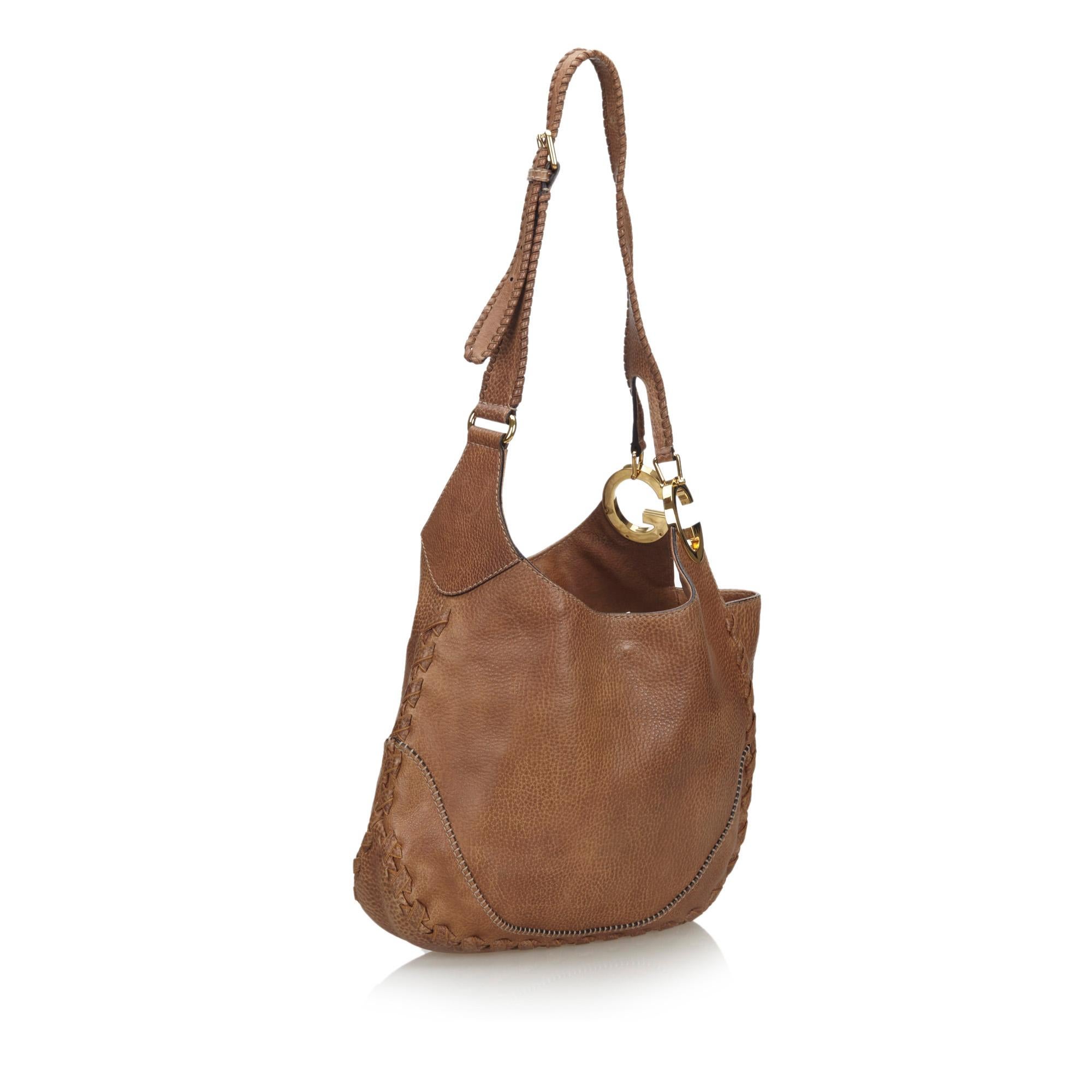 This Charlotte features a leather body, a flat leather strap, an open top with a magnetic closure, and interior zip and slip pockets. It carries as B+ condition rating.

Inclusions: 
This item does not come with inclusions.

Dimensions:
Length: