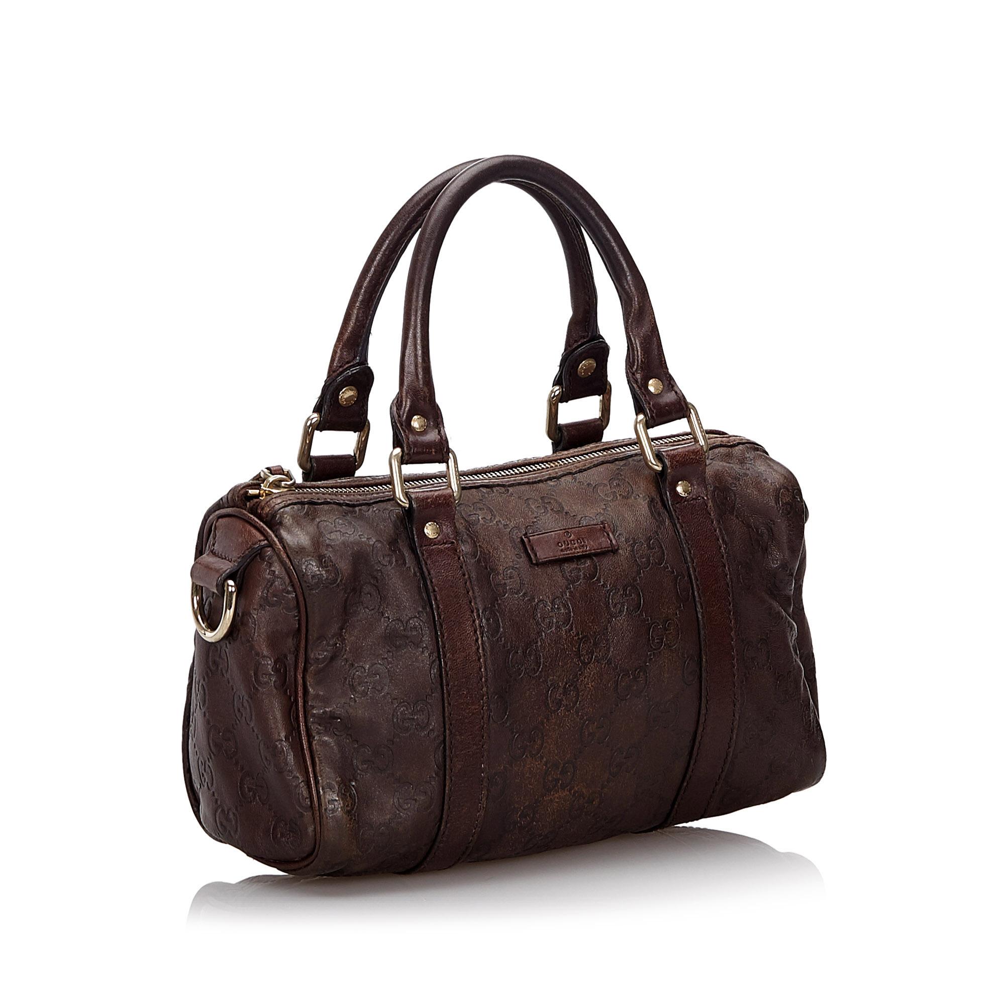 The Joy boston bag features a leather body, rolled leather handles, a top zip closure, and an interior zip pocket. It carries as B condition rating.

Inclusions: 
This item does not come with inclusions.

Dimensions:
Length: 16.00 cm
Width: 25.00