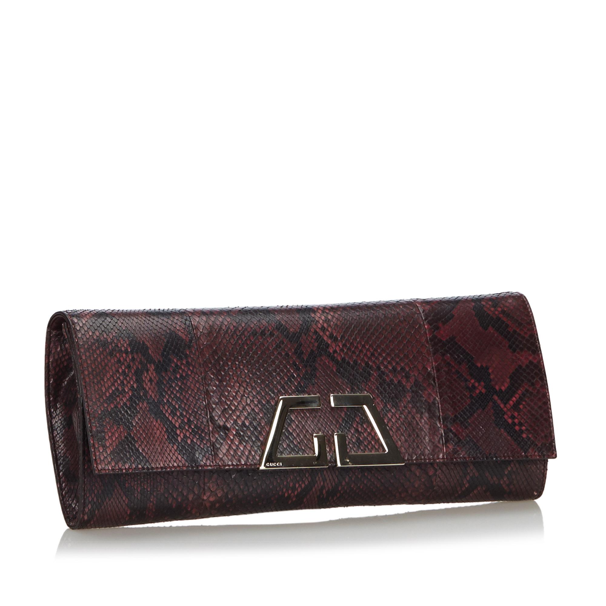 The G Night Clutch bag features a python leather body, a front flap with a magnetic closure, and an interior slip pocket. It carries as AB condition rating.

Inclusions: 
Dust Bag

Dimensions:
Length: 14.00 cm
Width: 32.00 cm
Depth: 2.00
