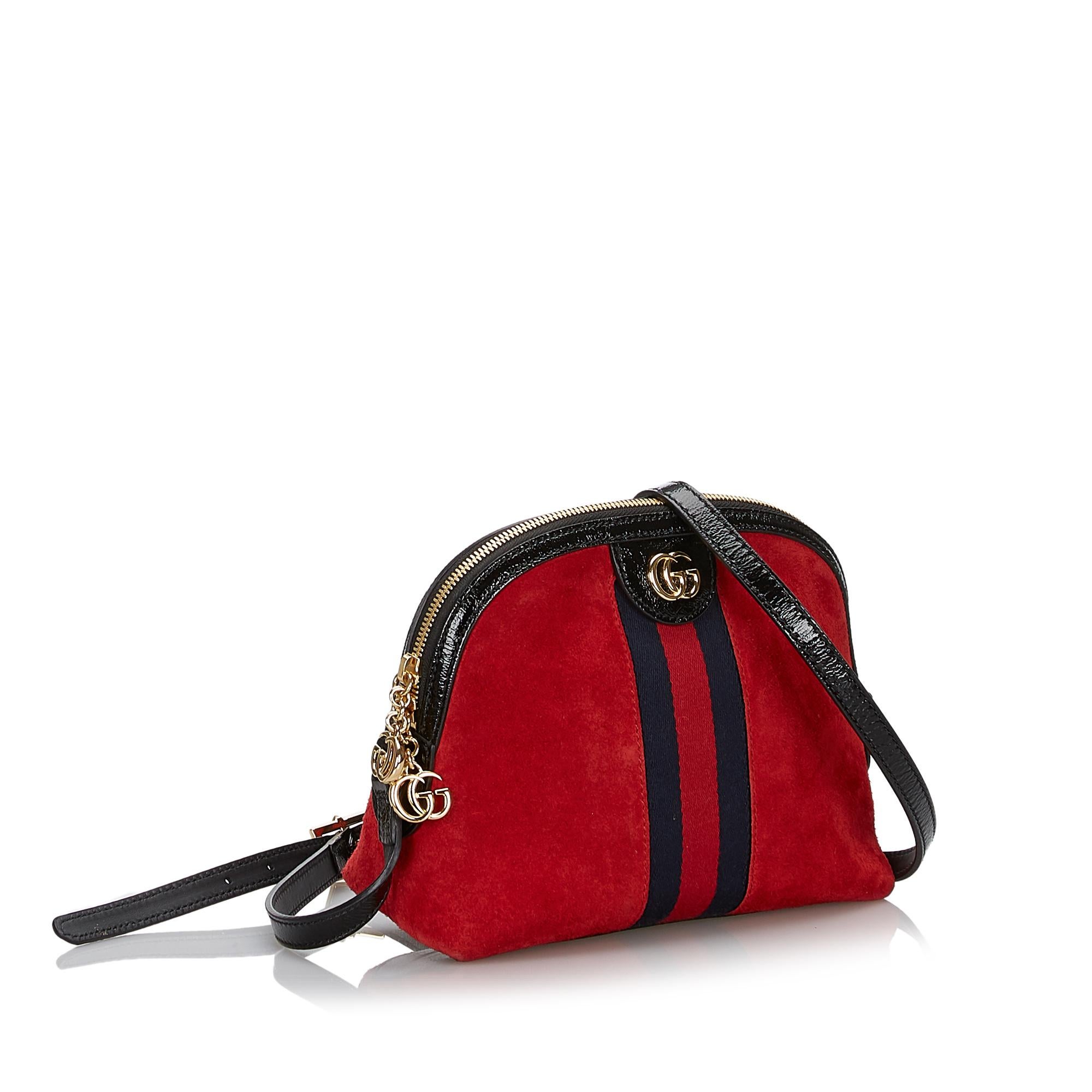 The Ophidia crossbody features a suede body, an adjustable flat leather strap, a gold-tone double G 2way top zip closure, and interior slip pockets. It carries as AB condition rating.

Inclusions: 
This item does not come with