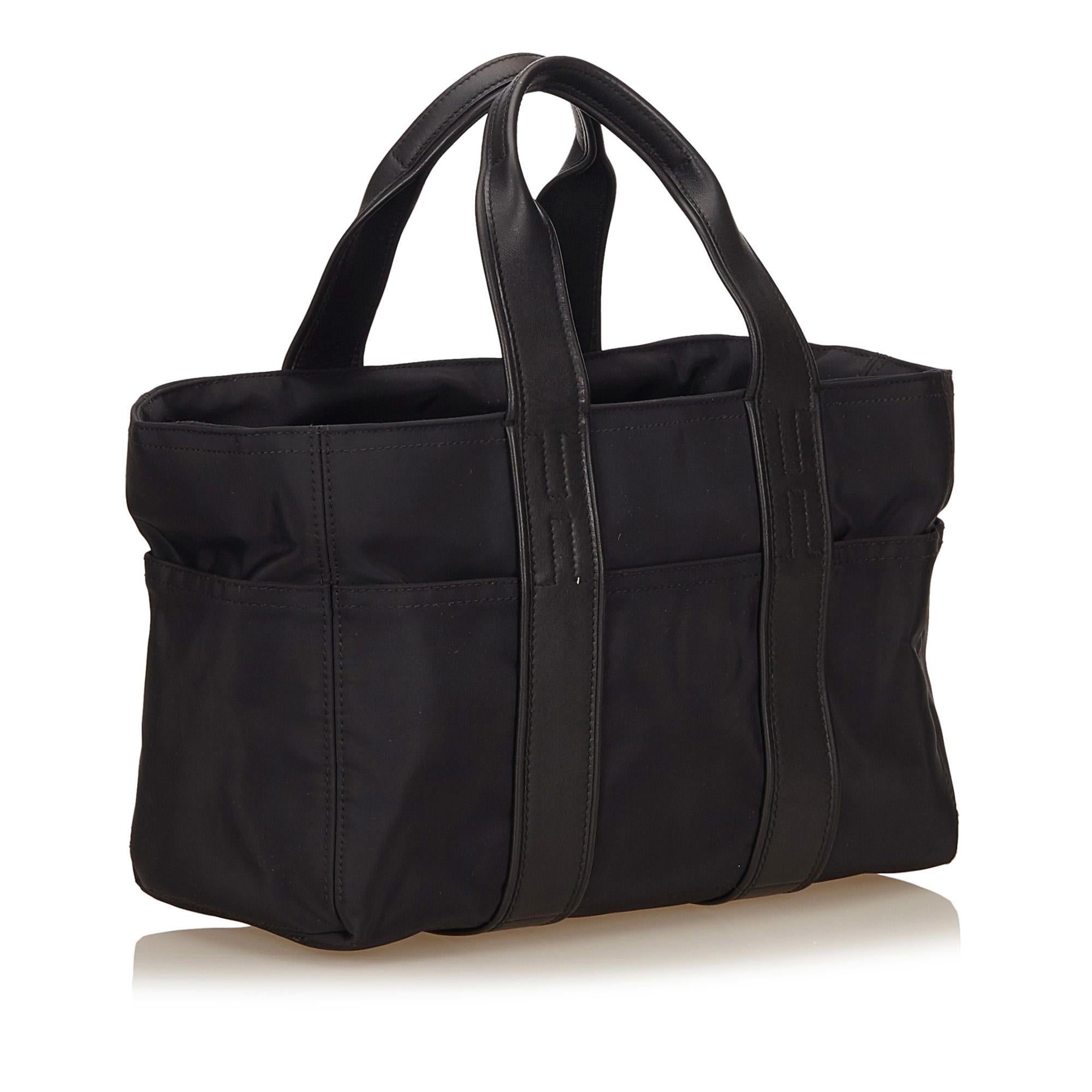 The Acapulco PM features a nylon leather, exterior slip pockets, flat leather straps, top zip closure, and interior zip pocket. It carries as B condition rating.

Inclusions: 
This item does not come with inclusions.

Dimensions:
Length: 35.00