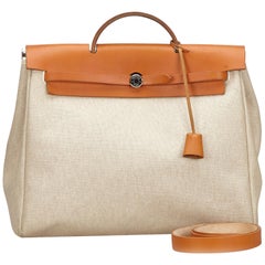 Sac à main Hermès Herbag MM vintage authentique avec clé à cadenas et cadenas médaillon