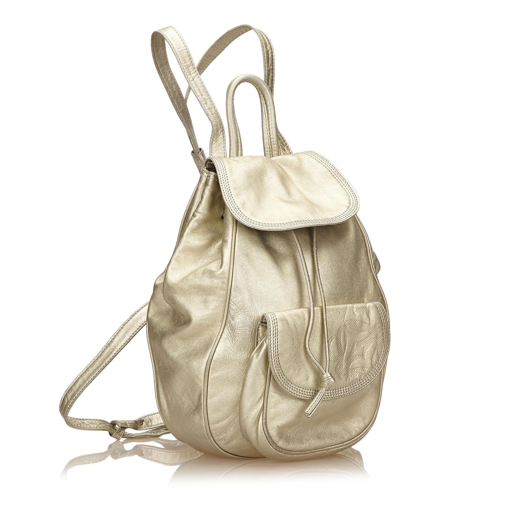 This backpack features a metallic leather body, exterior flap pocket, flat straps, flap top with drawstring closure, and interior zip and slip pocket. It carries as B+ condition rating.

Inclusions: 
This item does not come with