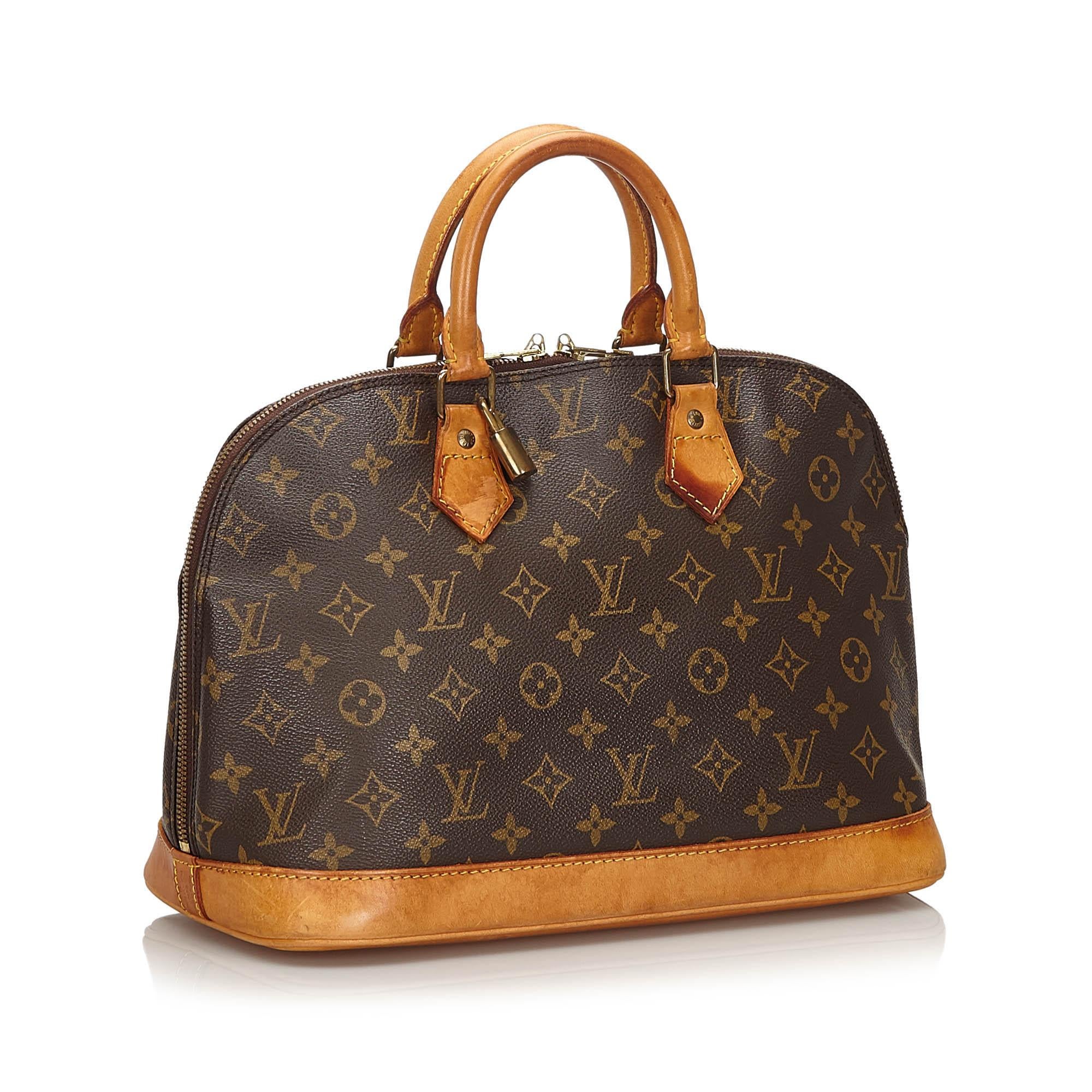 The Alma PM features a monogram canvas body, rolled leather handles, a leather bottom, a top zip closure, and an interior slip pocket. It carries as B condition rating.

Inclusions: 
Padlock
Padlock

Louis Vuitton pieces do not come with an
